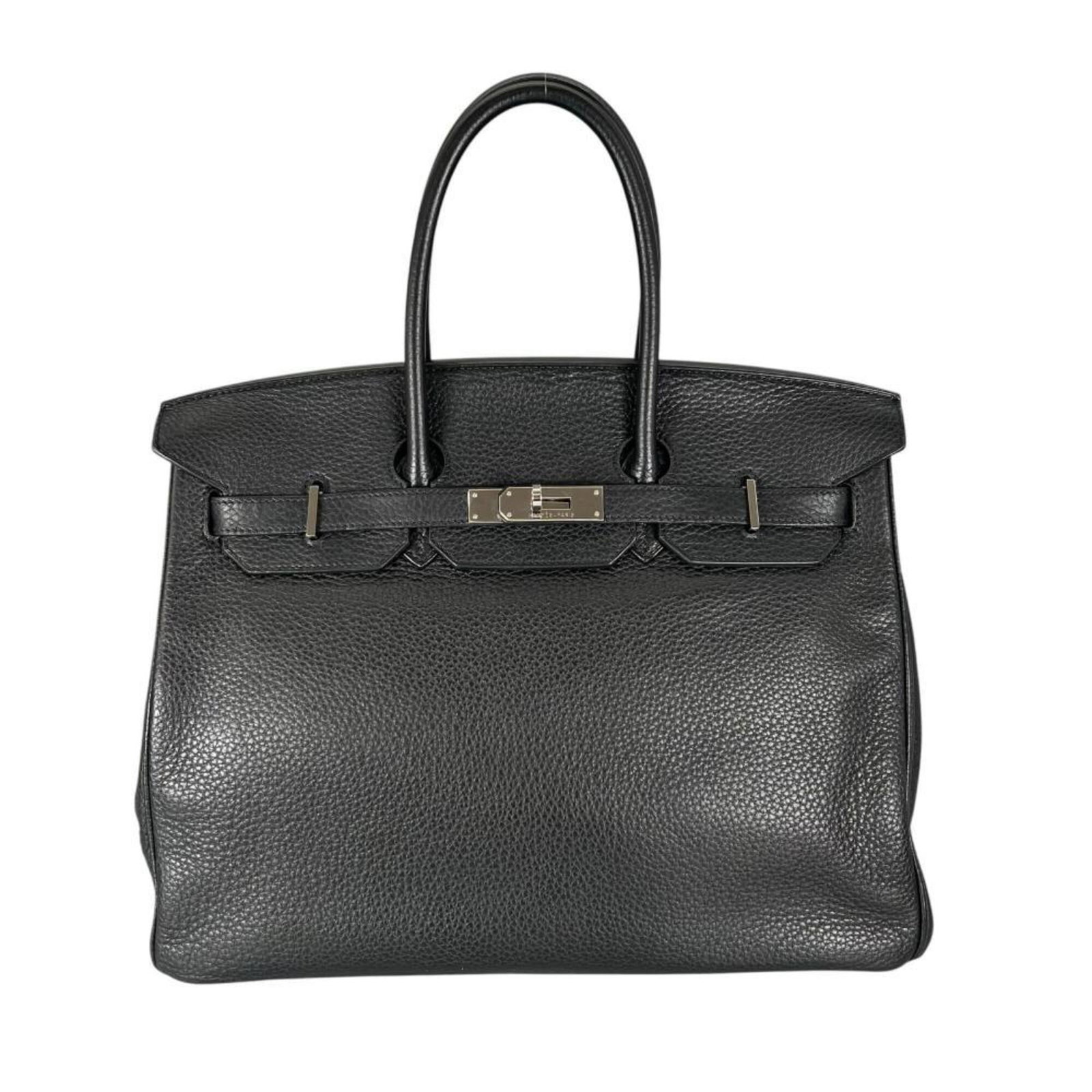 Clemence Leather Handbag Taurillon Hermes: Clemence Leather Handbag Taurillon Hermes Taurillon clemence leather gives this black handbag a sophisticated, luxurious feel. Measuring 26cm x 33cm x 18cm, it's a stylish and compact accessory. Item