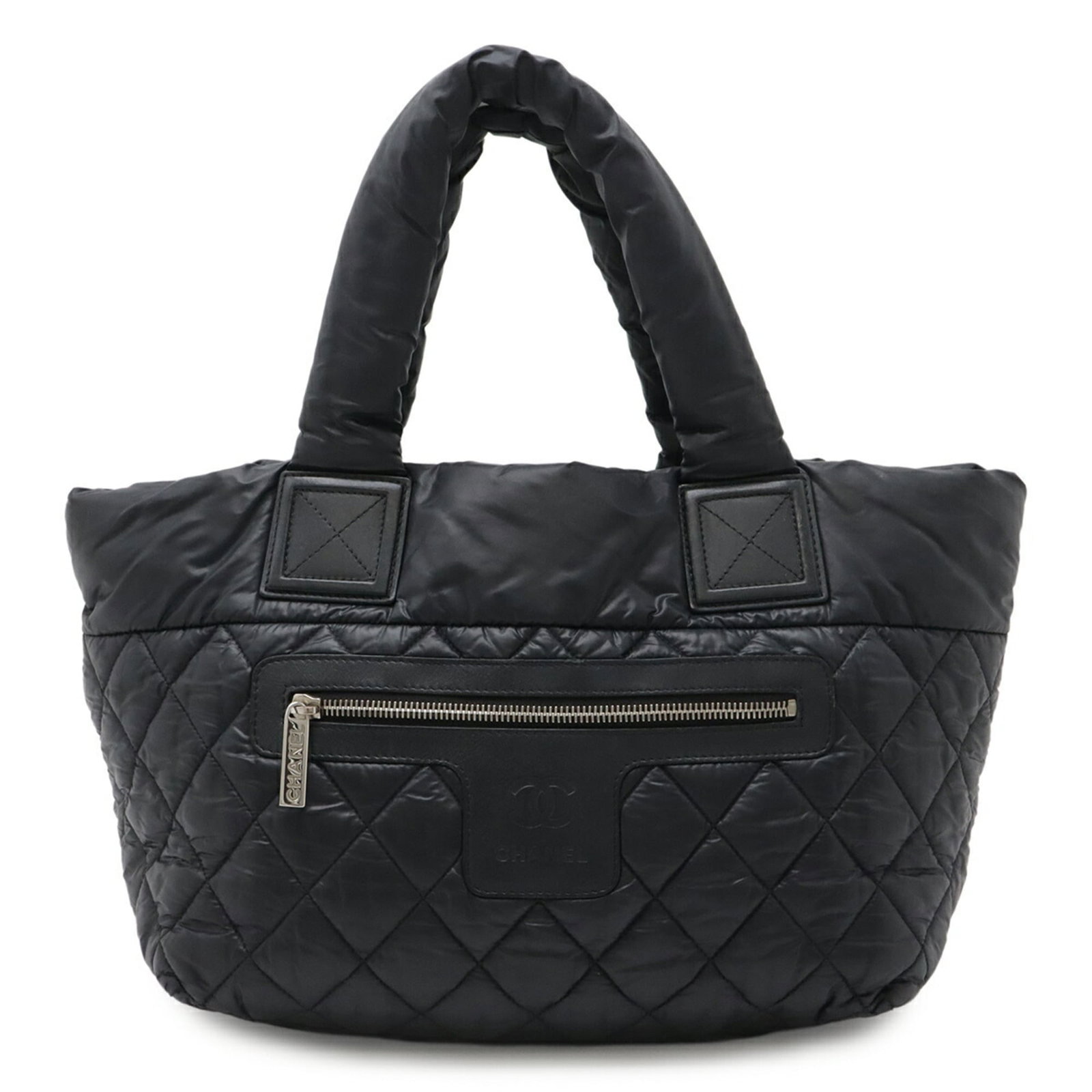 Nylon Leather Tote Chanel Bag Handbag: Nylon Leather Tote Chanel Bag Handbag Nylon and leather blend creates a unique look in this black Chanel-inspired tote bag. Measuring 22cm x 29cm x 16.5cm, it offers a spacious interior and a stylish 