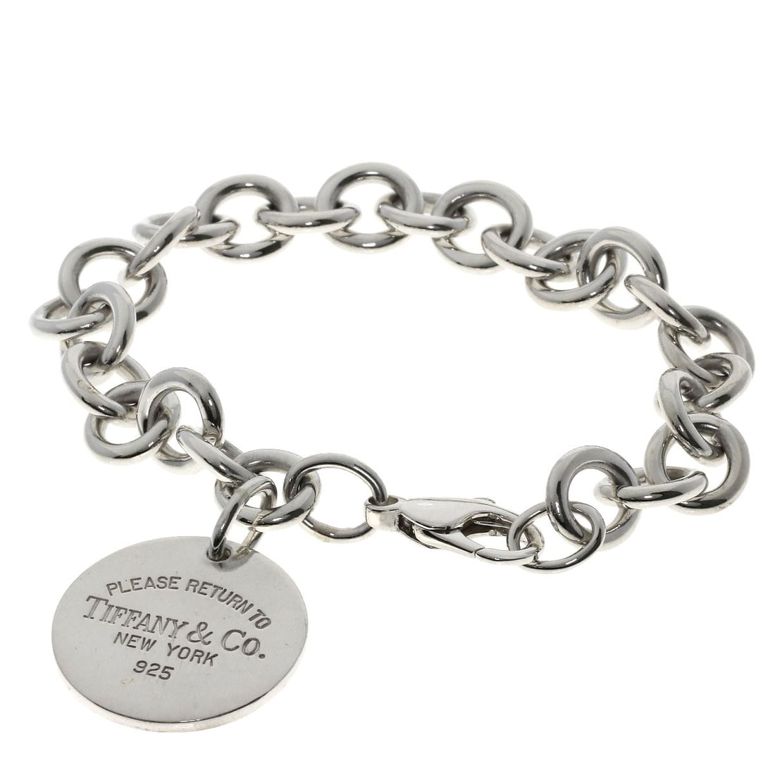 Return to Tiffany Round Silver Bracelet: Return to Tiffany Round Silver Bracelet Silver Round Bracelet from Tiffany&Co. features a sleek, silver design with no stone. This classic bracelet is made from high-quality silver metal, adding a tou