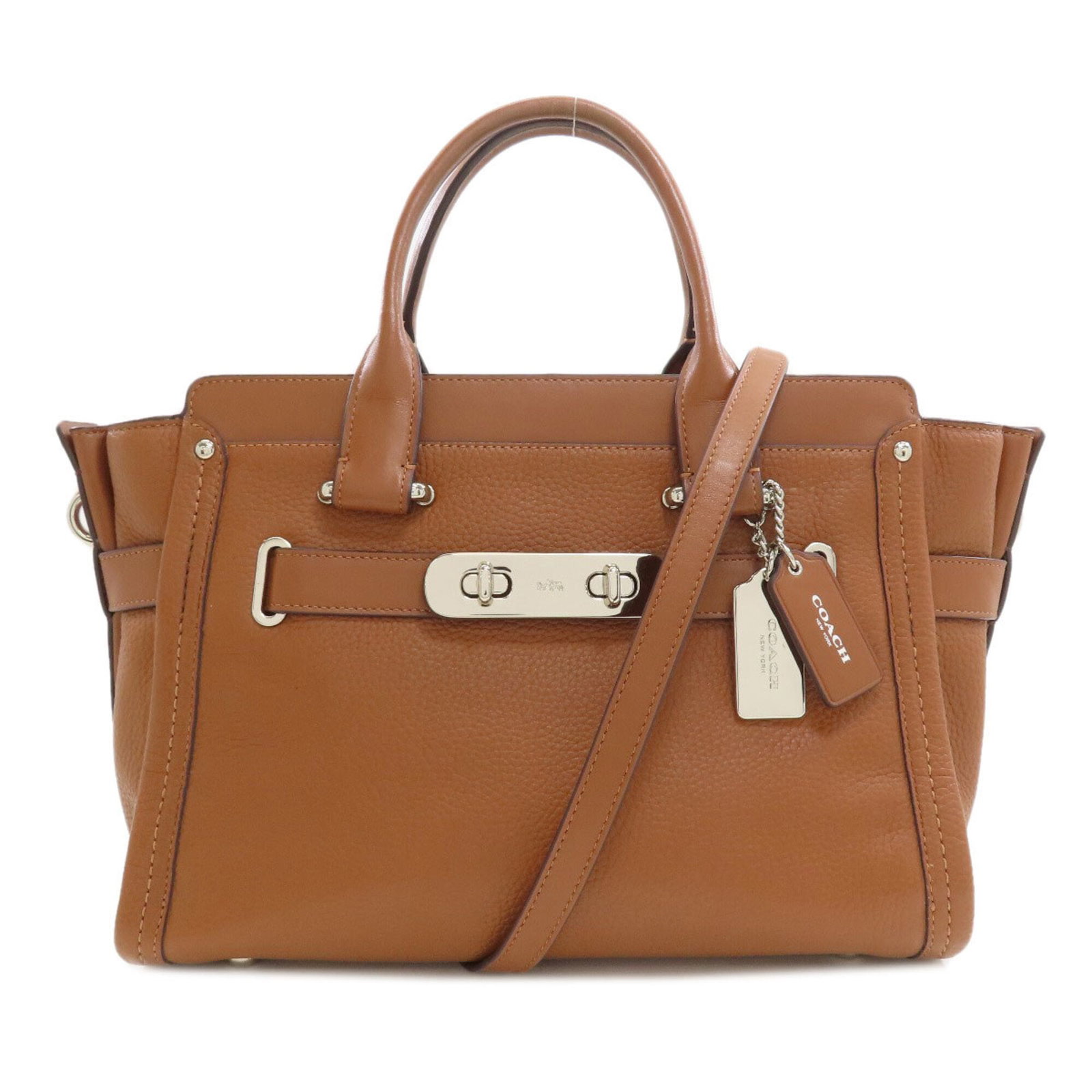 Handbag Leather Coach: Handbag Leather Coach Brown leather Coach handbag with a zipper closure, measuring 24cm x 42cm x 15cm and featuring a 27cm handle and adjustable strap length. This classic design is a timeless