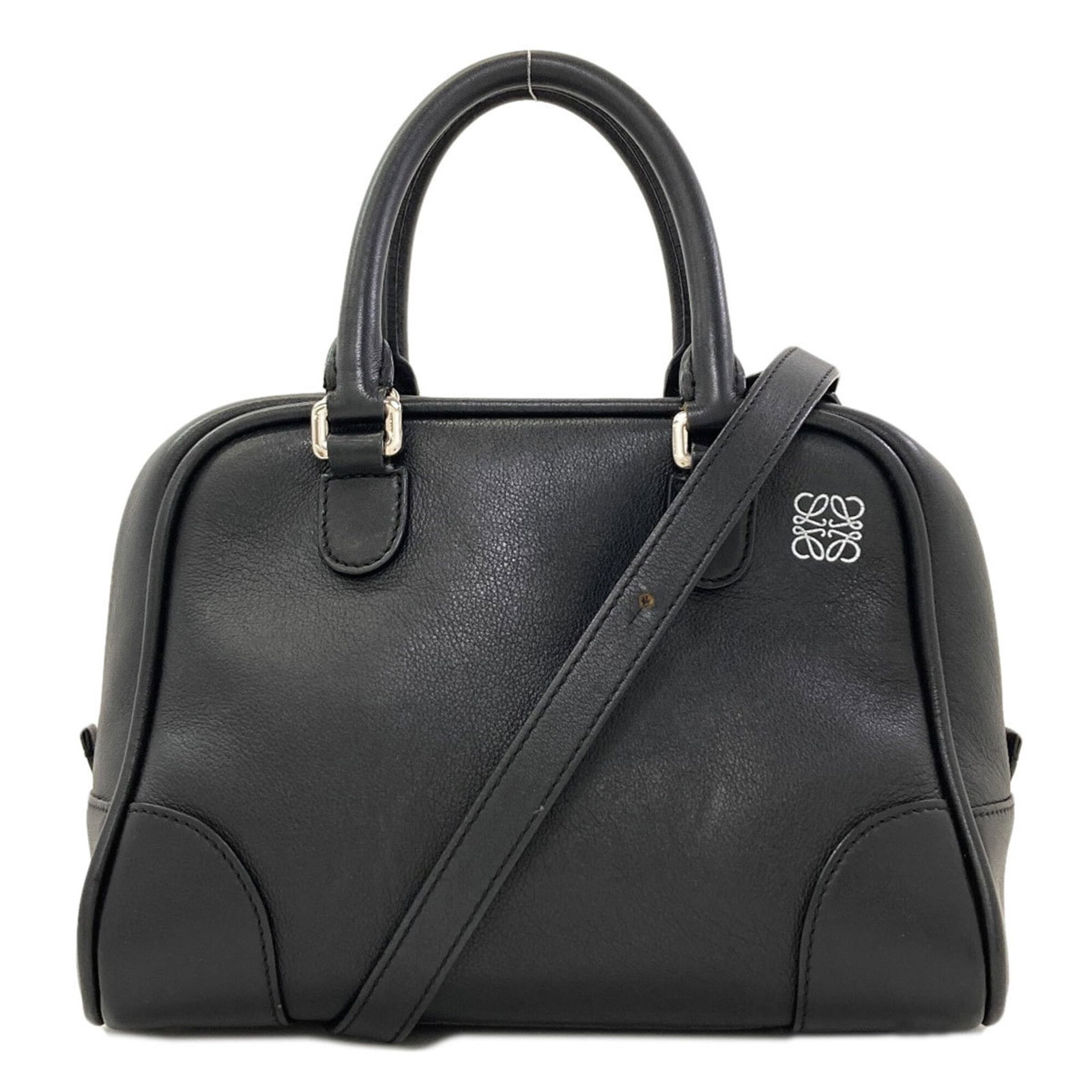 Handbag Leather Handbag: Handbag Leather Handbag This black calfskin leather handbag features a sleek design and premium material. Made from high-quality leather, it boasts a classic style that is sure to complement any outfi