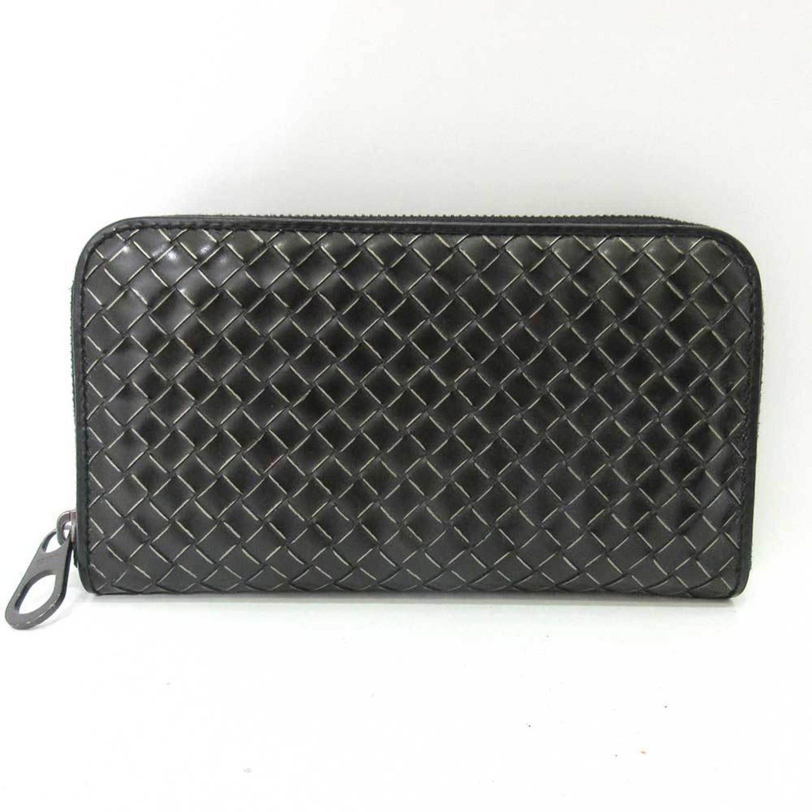Bottega Veneta Long Wallet (Bi-Fold) Leather: Bottega Veneta Long Wallet (Bi-Fold) Leather Bottega Veneta's iconic bi-fold wallet features a sleek black leather design with a zipper closure, measuring 10.5cm x 19cm x 2cm. This long wallet is craf
