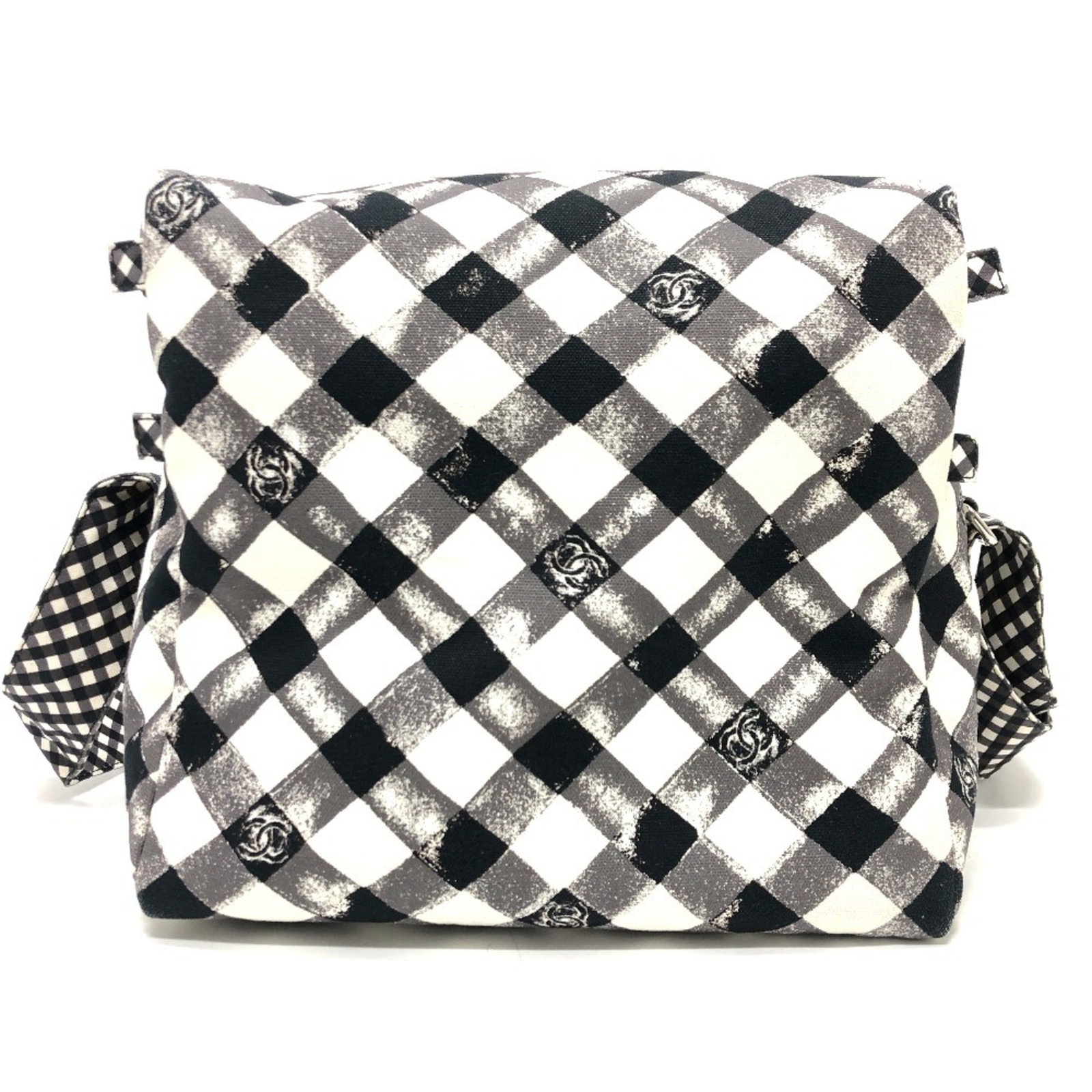 Shoulder Bag Canvas By Chanel: Shoulder Bag Canvas By Chanel Canvas By Chanel Shoulder Bag in Black and White. This sleek shoulder bag features a canvas material and silver hardware, with a timeless design that exudes classic