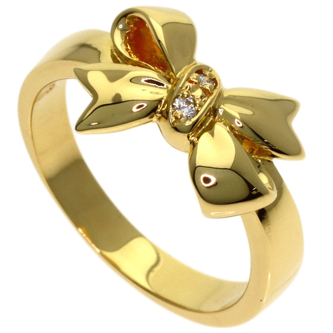 K18 Yellow Gold Mikimoto Diamond Ribbon Ring: K18 Yellow Gold Mikimoto Diamond Ribbon Ring K18 Yellow Gold Mikimoto Diamond Ribbon Ring boasts a striking gold design, featuring a diamond set in a ribbon-style setting. This 5.25 US ring size
