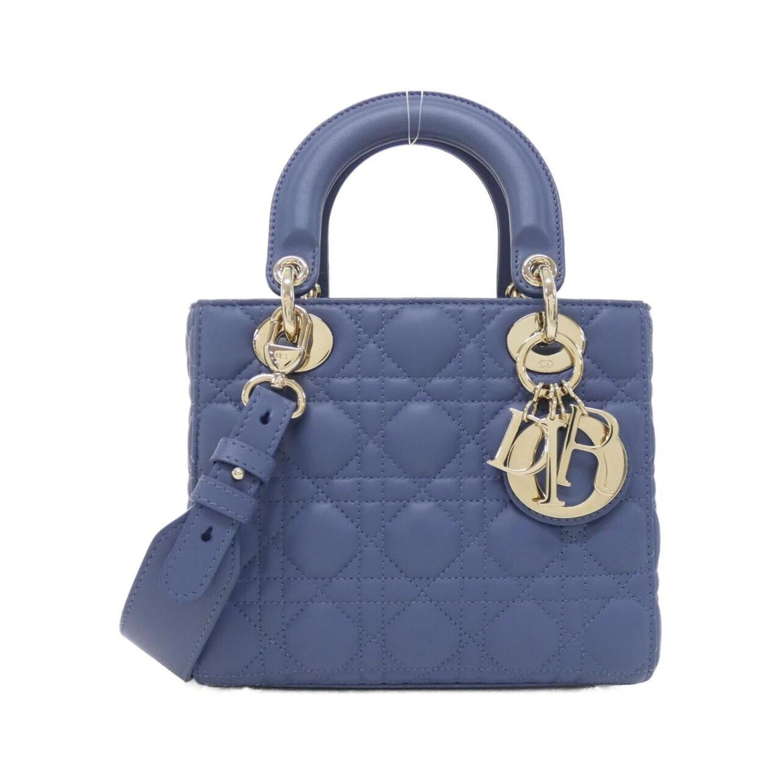 Handbag Leather Dior Christian: Handbag Leather Dior Christian The Lady Dior handbag from Christian Dior is a stunning blue lambskin leather bag with gold hardware, measuring 17cm x 20cm x 8cm. This luxurious handbag features