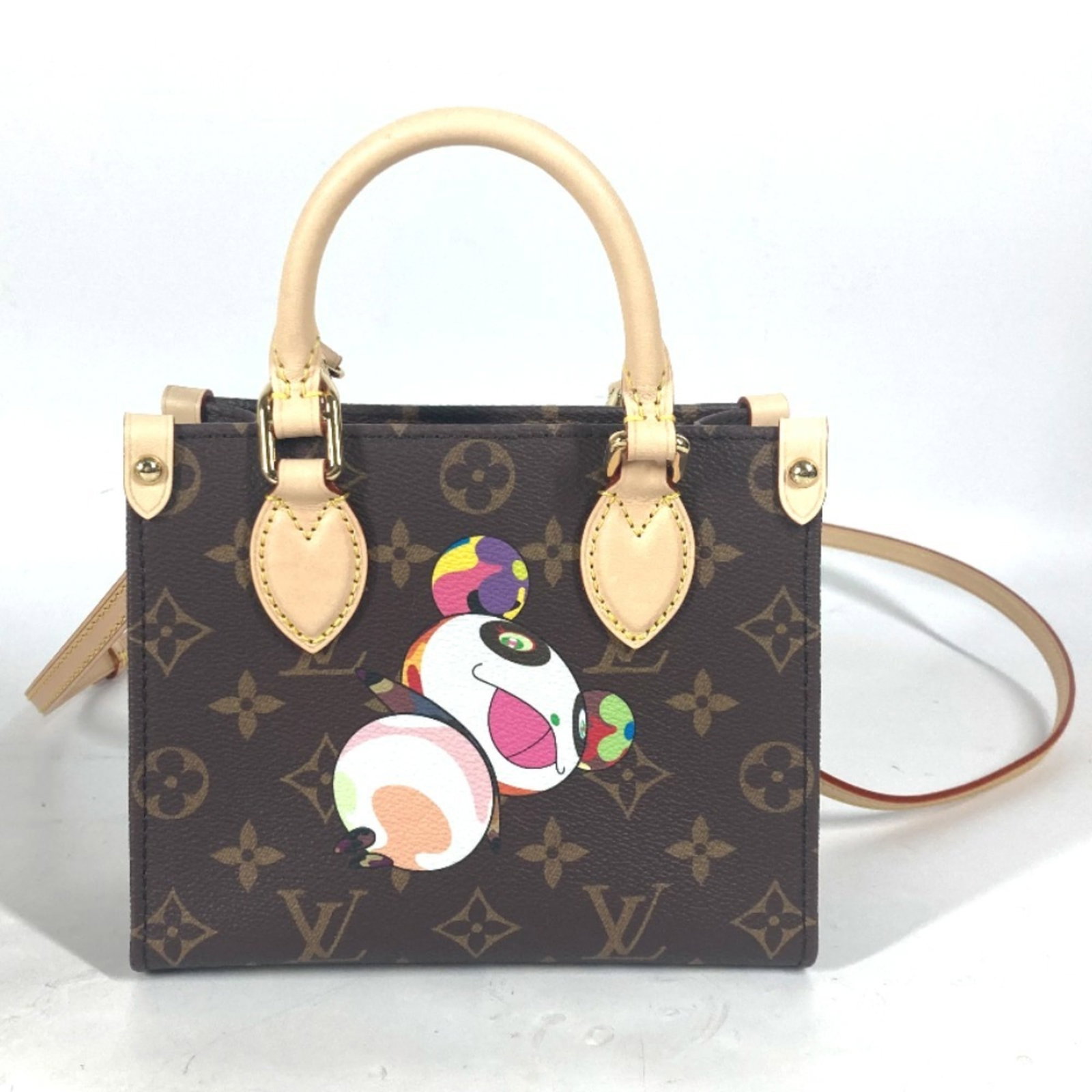 Canvas Monogram Louis Vuitton: Canvas Monogram Louis Vuitton Canvas Monogram Louis Vuitton, a classic design featuring the iconic monogram pattern, is presented in a rich brown canvas material. This compact bag, measuring 15cm x