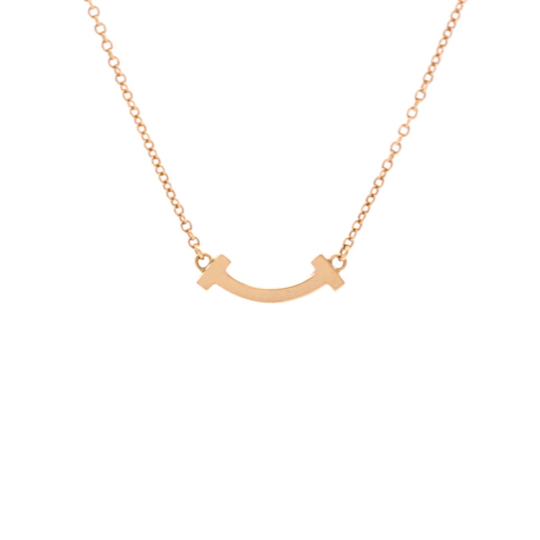 Tiffany Smile Pendant Necklace 18K Rose Gold Mini: Tiffany Smile Pendant Necklace 18K Rose Gold Mini Tiffany & Co.'s 18K Rose Gold Mini Smile Pendant Necklace is a delicate, rose gold masterpiece. This 16.0-18.0" necklace features a 4.65 mm x 14.45