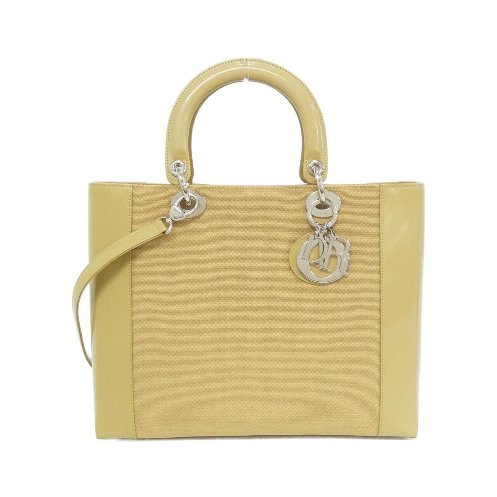 Canvas Leather Handbag Dior Christian: Canvas Leather Handbag Dior Christian Canvas and leather come together in this elegant Dior handbag, featuring a classic design with a beige color that adds a touch of sophistication. Measuring