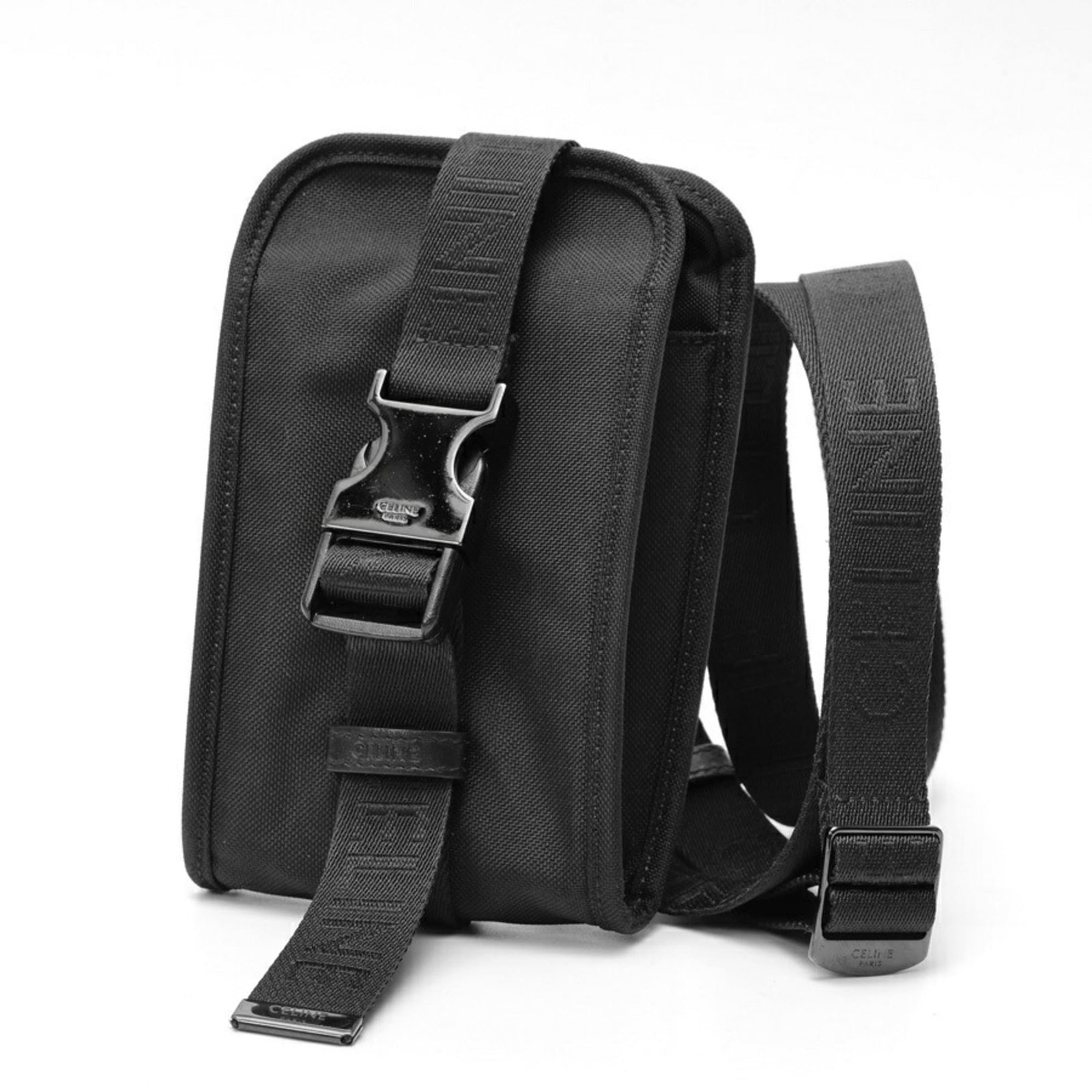 Celine Pouch Nylon: Celine Pouch Nylon The Celine Pouch Nylon is a sleek and modern accessory made from high-quality nylon material. Measuring 17.5cm x 10cm x 1.5cm, this compact pouch features a black color and a durabl