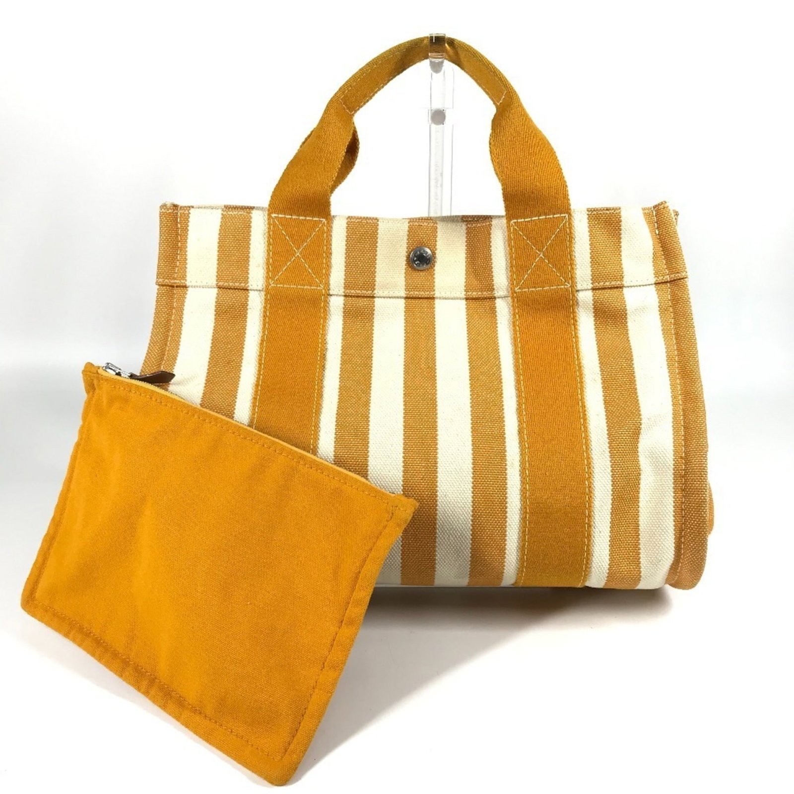 Handbag Tote Bag Canvas Hermes: Handbag Tote Bag Canvas Hermes Canvas Hermes tote bag in white and yellow, measuring 24.5cm x 33.5cm x 19cm, features a classic design. Made from canvas material, this handbag tote bag has a clean
