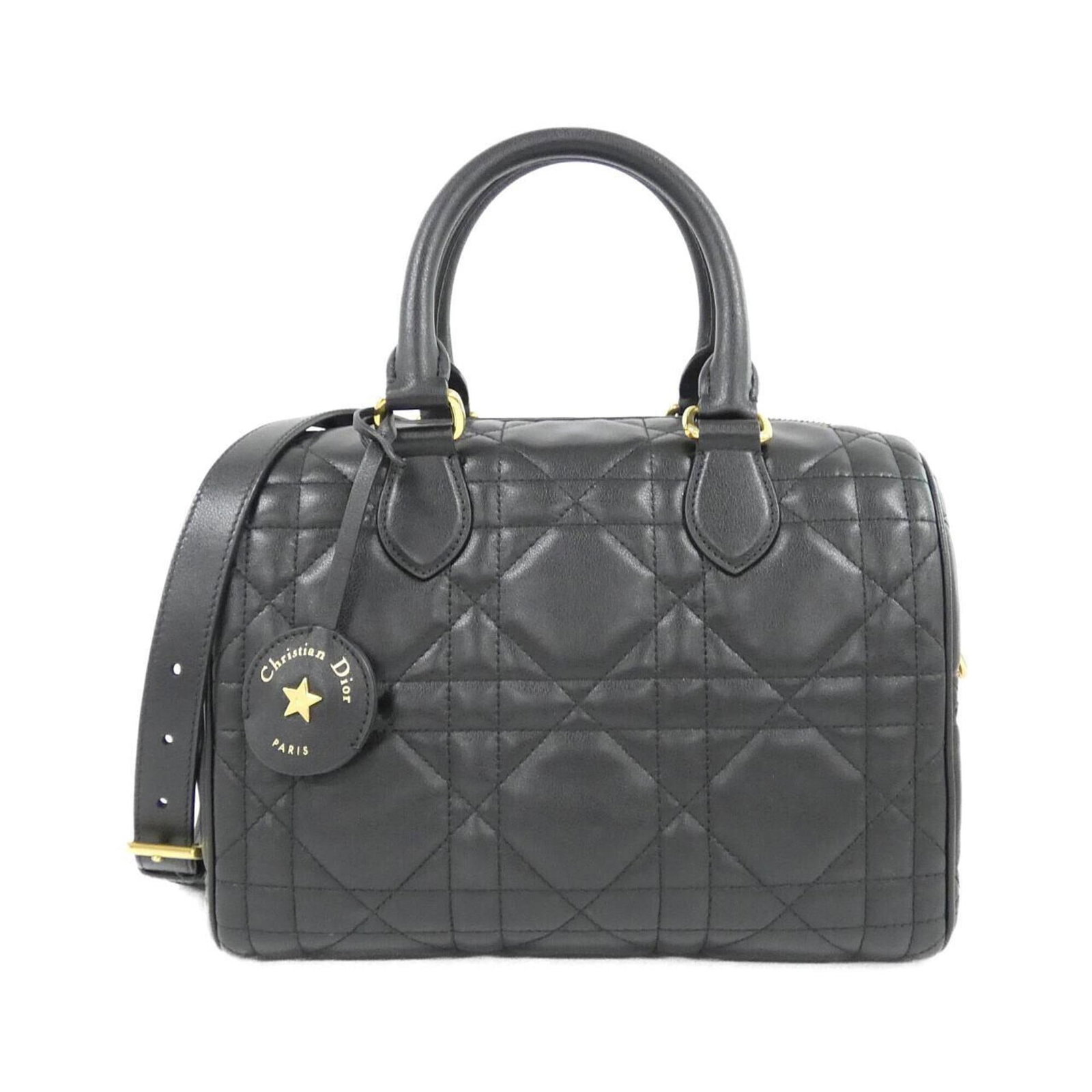 Handbag Leather Dior Christian: Handbag Leather Dior Christian Black Calfskin Handbag from Christian Dior, featuring gold hardware and a sturdy 32cm handle. Made from high-quality leather, this M1365UBOL model boasts a sleek design