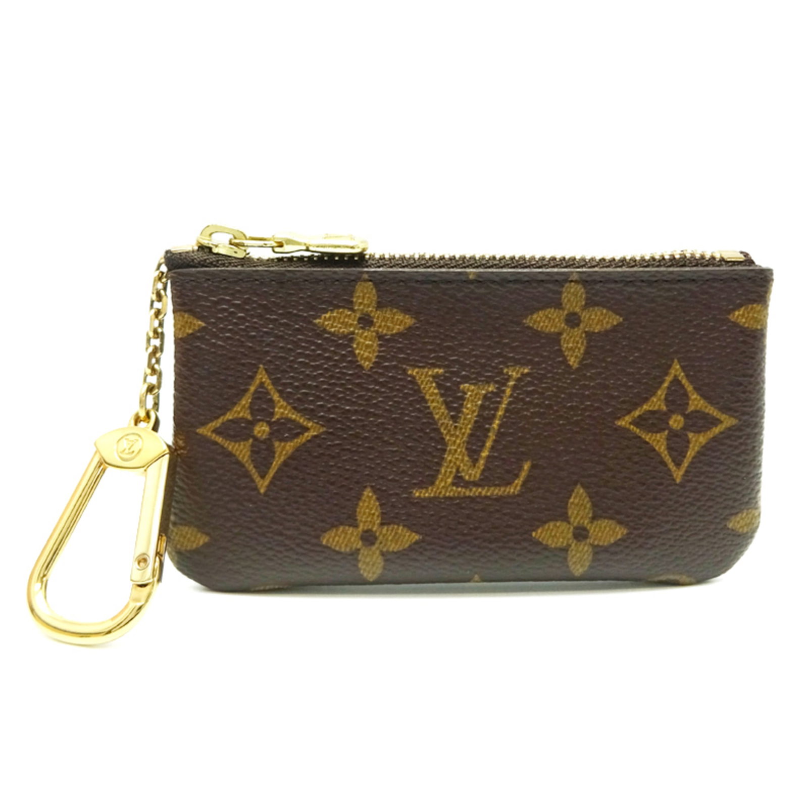 Coin purse Monogram Louis Vuitton: Coin purse Monogram Louis Vuitton Monogrammed with iconic Louis Vuitton design, this brown coin purse boasts a classic, timeless look. Made from high-quality materials, its compact size makes it
