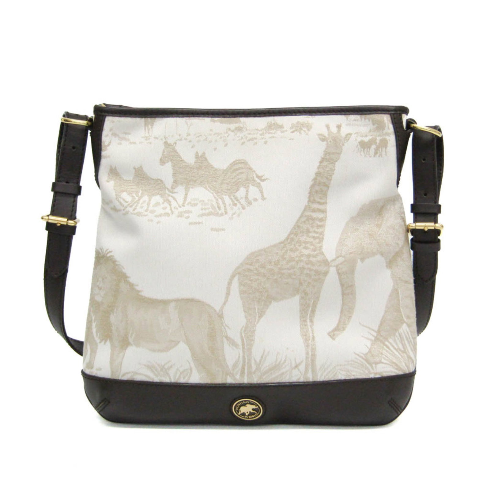 Shoulder bag leather canvas hunting world: Shoulder bag leather canvas hunting world Leather and canvas blend in this unique shoulder bag from Hunting World, featuring a top zipper closure and open pocket. The bag's brown and light beige