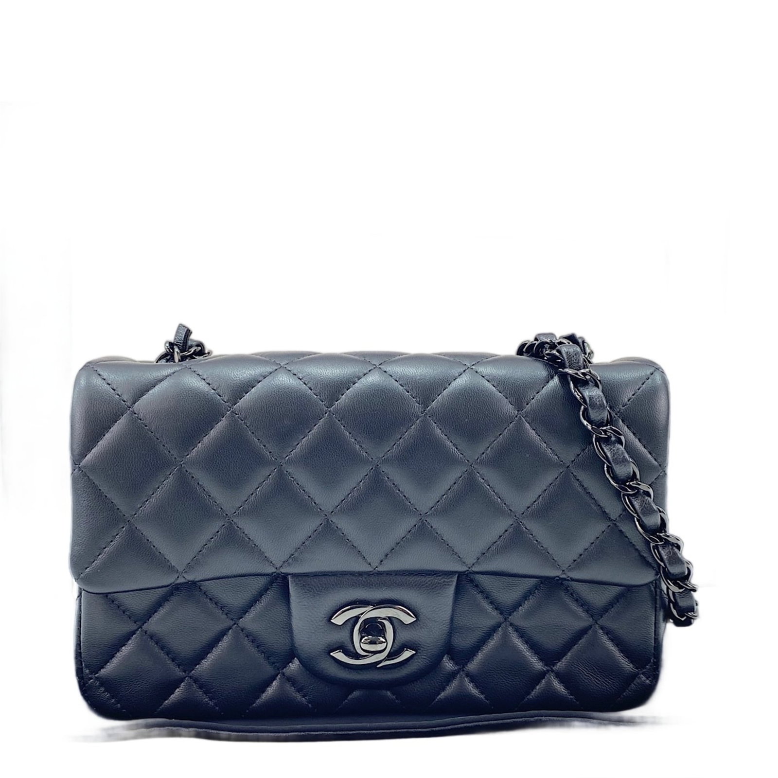 Shoulder Bag by Chanel: Shoulder Bag by Chanel Black Chanel shoulder bag with dimensions 12cm x 20cm x 6cm. This sleek and compact bag features a classic design that exudes timeless elegance. Its understated size makes it a