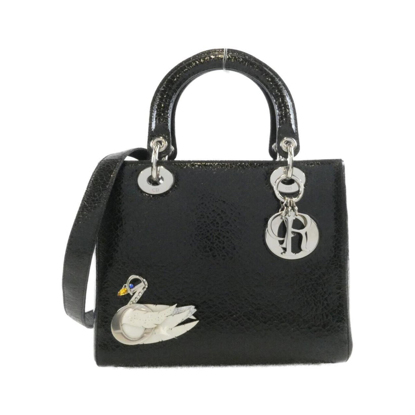 Handbag Christian Dior: Handbag Christian Dior This black Christian Dior handbag features silver hardware and measures 20cm x 24cm x 12cm. Its sleek design and classic style make it a timeless accessory for any woman. The