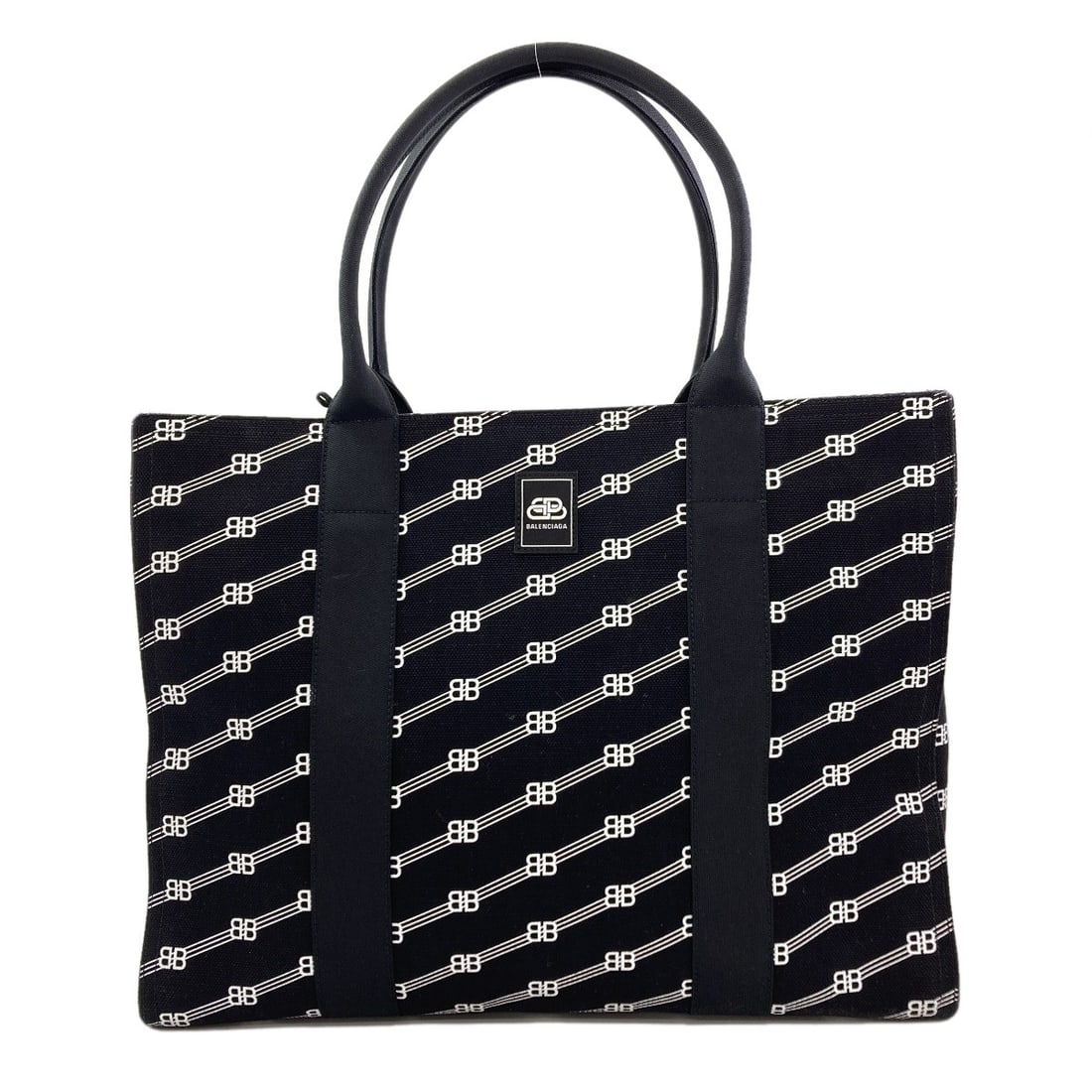 Tote Bag Canvas Bbmonogram Balenciaga: Tote Bag Canvas Bbmonogram Balenciaga Black canvas tote bag from Balenciaga features a bold monogram design. The canvas exterior is a sleek black color, adding a touch of sophistication to this
