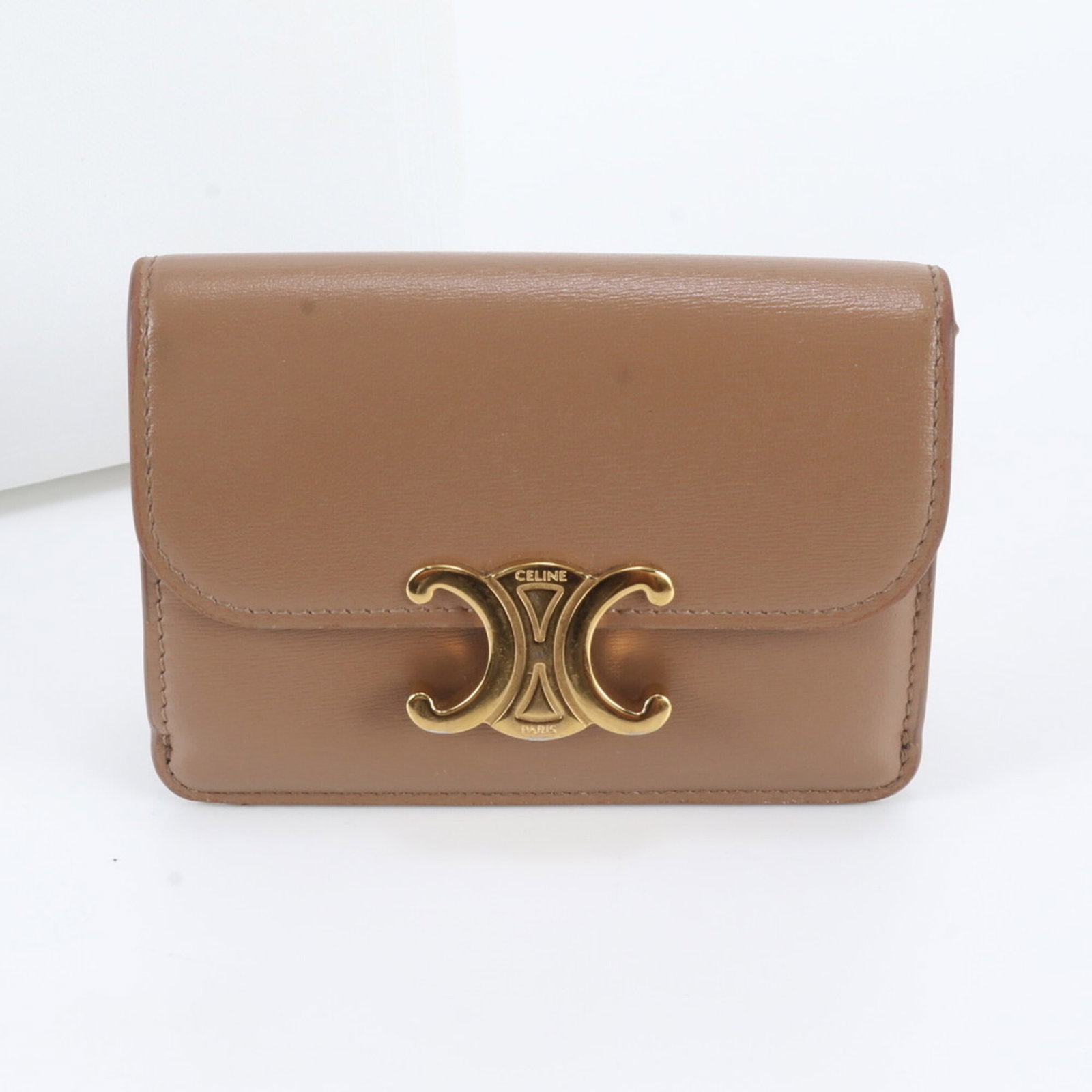 Card Case Leather Celine: Card Case Leather Celine Brown leather card case from Celine, Italy, featuring a classic design with a card holder for organization. Made from high-quality leather, this compact case measures 8cm x
