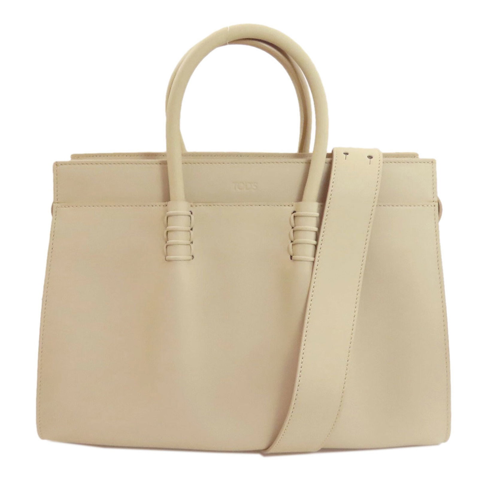 Handbag Leather Tod'S: Handbag Leather Tod'S Tod's Handbag in Ivory Leather features a sleek and sophisticated design with a zipper closure, measuring 23.5cm x 31cm x 17cm. The spacious interior is complemented by a 24cm