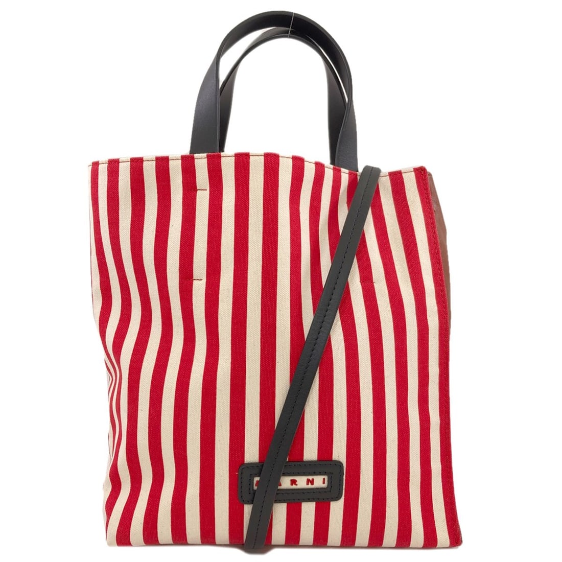 Stripe Marni 2Way Tote Bag Leather Canvas: Stripe Marni 2Way Tote Bag Leather Canvas Red Marni 2Way Tote Bag with canvas exterior, a stylish and versatile tote. The bag's bold red color and canvas material make it a striking accessory. A