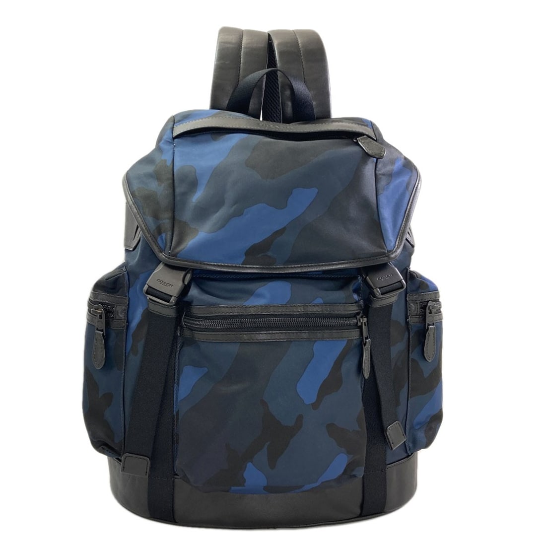F54783 Nylon Backpack Daypack Camouflage Pattern: F54783 Nylon Backpack Daypack Camouflage Pattern Nylon backpack with a camouflage pattern, made from blue exterior material, and a blue interior. This daypack has a classic design, featuring a durable