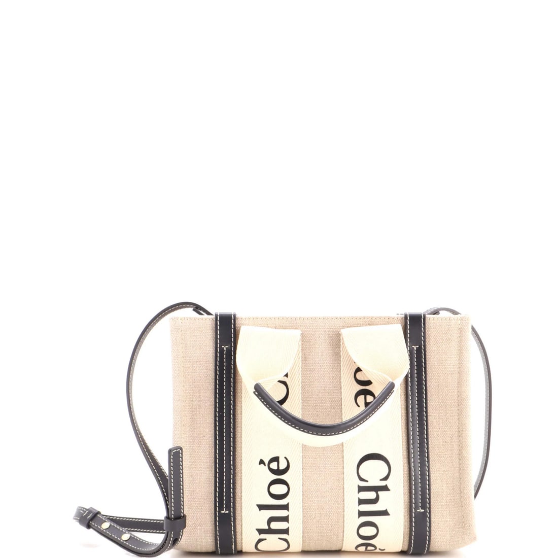 Woody Canvas Tote Small Leather Chloe: Woody Canvas Tote Small Leather Chloe Small Leather Chloe Woody Canvas Tote in Black. This small leather tote features a canvas exterior with a plain leather trim and a neutral interior. With its