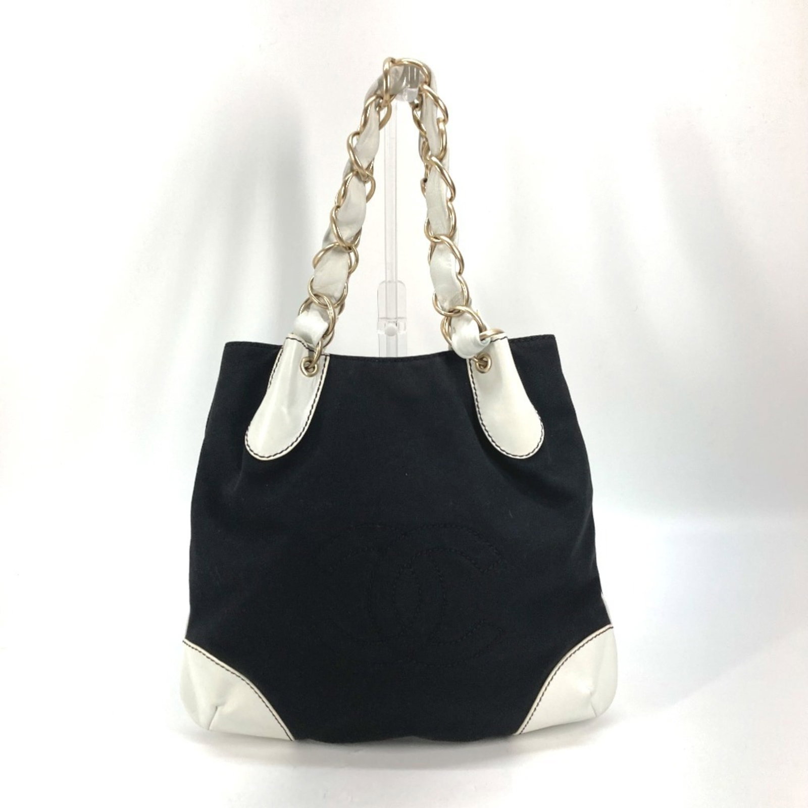 Chanel Shoulder Bag Tote Bag Canvas Leather: Chanel Shoulder Bag Tote Bag Canvas Leather Canvas and leather come together in this sleek Chanel shoulder bag tote, available in black and white. Measuring 30cm x 25cm x 11.81'' x 9.84'', it's a