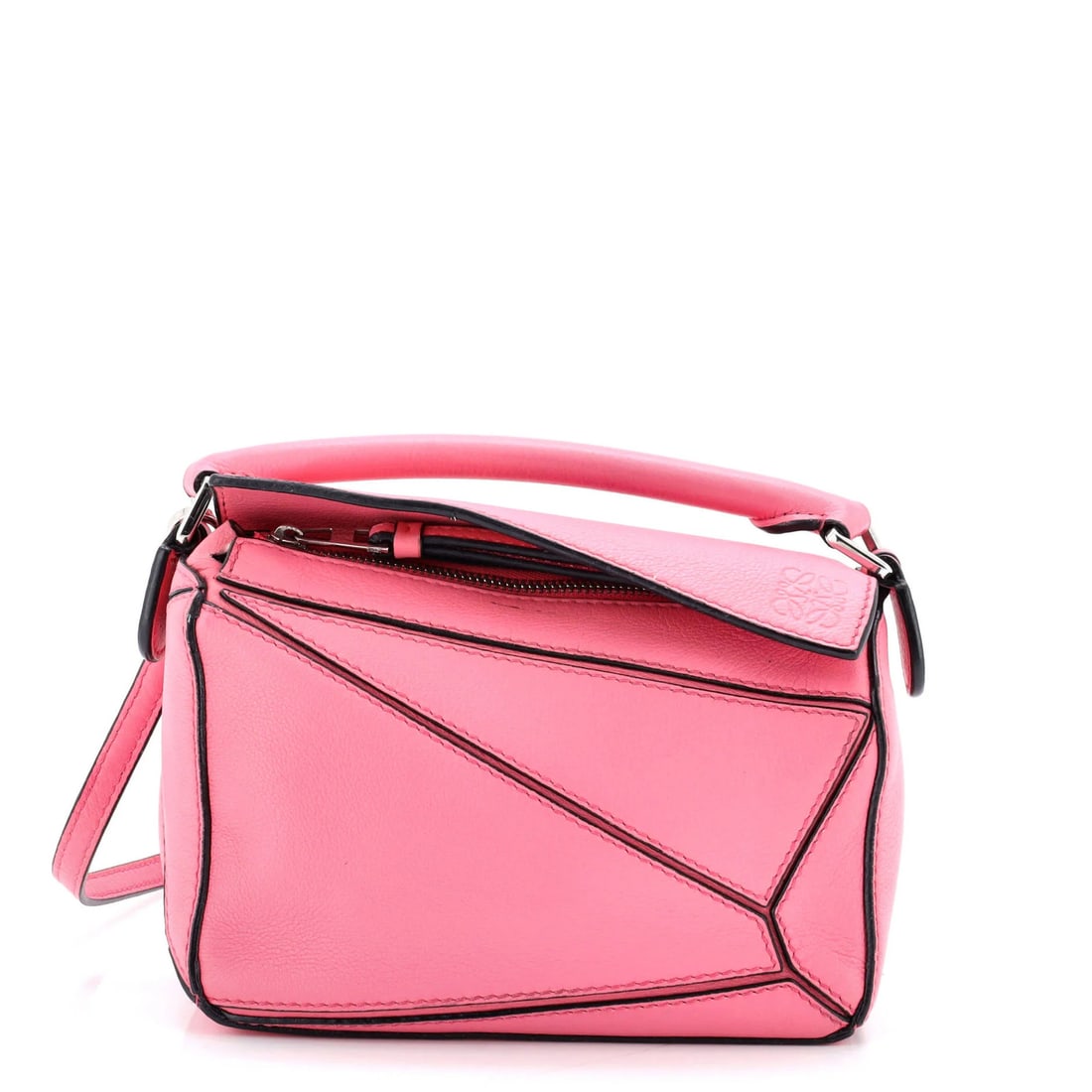 Loewe Puzzle Bag Leather Mini: Loewe Puzzle Bag Leather Mini The Loewe Puzzle Bag Leather Mini is a stylish cross-body bag with a sleek pink leather exterior and neutral interior. Measuring 4.5" tall and 7" wide, this compact bag
