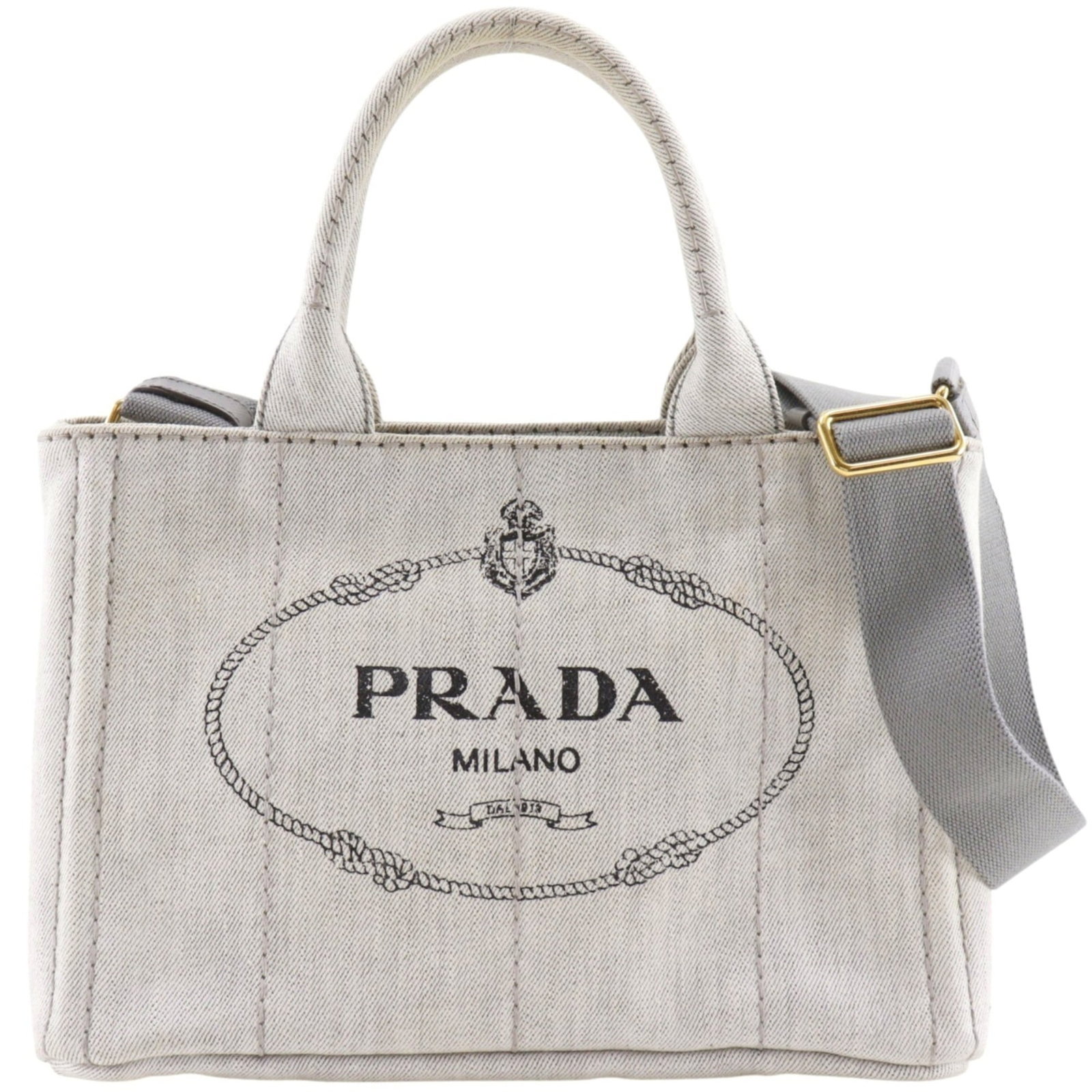Denim Cotton Tote Bag Handbag Prada: Denim Cotton Tote Bag Handbag Prada Cotton and denim blend in a versatile gray tone, defining this Prada Canapa tote bag. Measuring 19cm x 28cm x 14cm, it features a sturdy handle drop of 12cm and adj