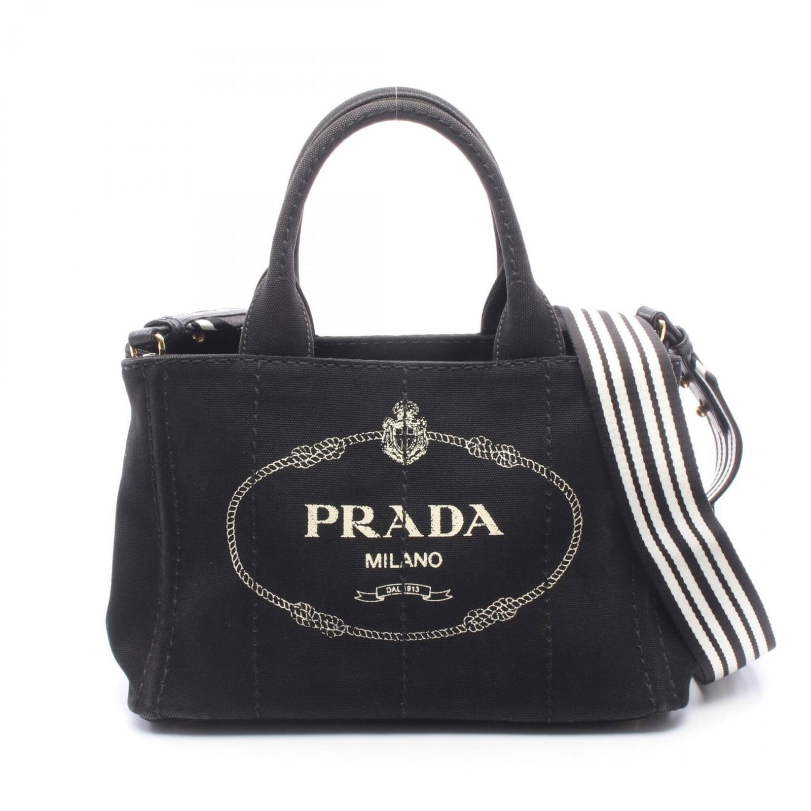Canvas tote bag Prada handbag: Canvas tote bag Prada handbag Canvas tote bag in black and white, featuring a Prada design. This 19cm x 28cm x 14cm tote bag is made of canvas material and bears a signature. The Prada handbag is a