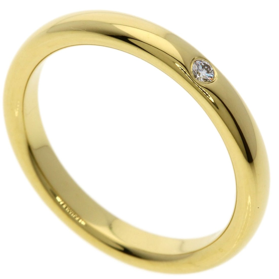 Diamond K18 Yellow Gold Band Ring Tiffany&Co. Stacking: Diamond K18 Yellow Gold Band Ring Tiffany&Co. Stacking K18 Yellow Gold Band Ring from Tiffany&Co. - A sleek and sophisticated stacking ring featuring a diamond set in a sturdy K18 yellow gold band.