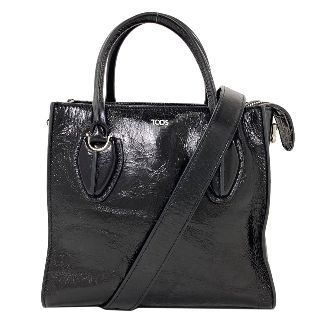 Tods 2Way Handbag Leather: Tods 2Way Handbag Leather Tods 2Way Handbag Leather is a sleek and sophisticated black leather handbag with a 2-way design. Made from high-quality leather, this stylish accessory is a great addition