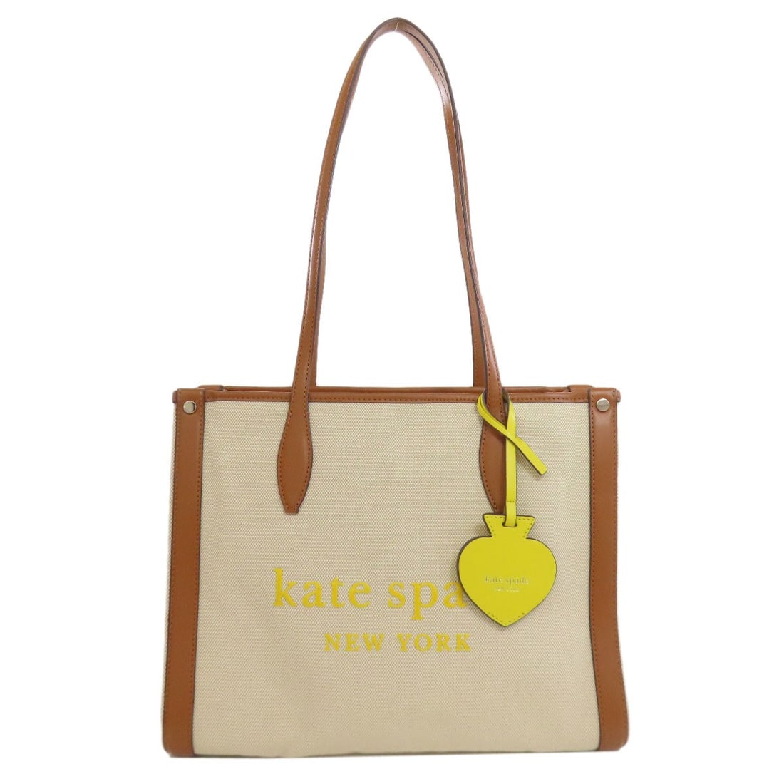 Canvas Leather Kate Spade Tote Bag: Canvas Leather Kate Spade Tote Bag Beige canvas tote bag from Kate Spade, featuring a classic design with a 10.6 inch height, 5.5 inch depth, and 13.6 inch width. The bag has a zip closure and bears a