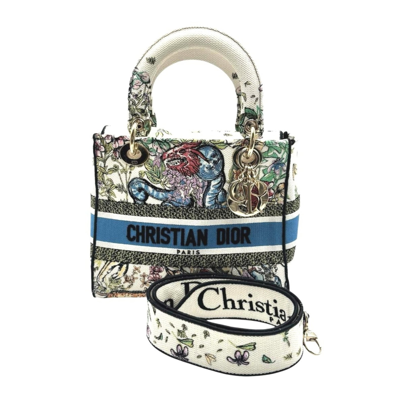 Christian Dior Handbag Canvas: Christian Dior Handbag Canvas Canvas from Christian Dior's Lady Dior line, made in Italy, features a multi-color design and a classic flap closure. The handbag measures 20cm x 24cm x 11.5cm and weighs