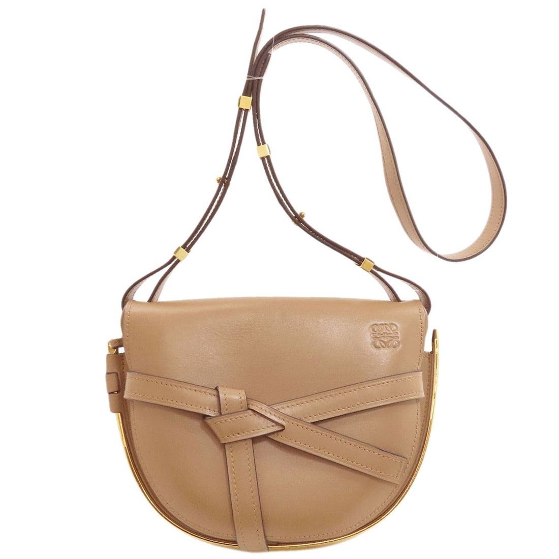 Loewe Gate Calf Shoulder Bag: Loewe Gate Calf Shoulder Bag Brown Loewe Gate Calf Shoulder Bag with a 7.9 inch height and 4.3 inch depth, featuring a calf exterior and a flap closure. This stylish shoulder bag measures 9.4 inches