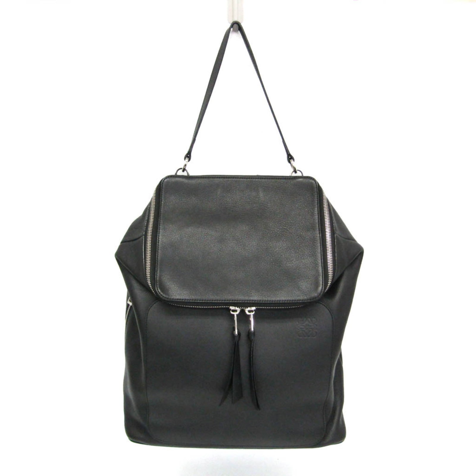 Backpack Leather Loewe: Backpack Leather Loewe Black Leather Loewe Backpack with Silver Hardware and Multiple Pockets. This sleek backpack features a 25cm opening, zipper pockets, and a snap pocket, making it a practical and