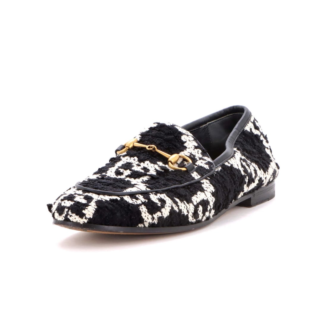 Women's Gucci Tweed Loafers Jordaan: Women's Gucci Tweed Loafers Jordaan Tweed details add a unique touch to these Gucci Women's Jordaan Loafers. With a black and white exterior and brown leather interior, these loafers feature a