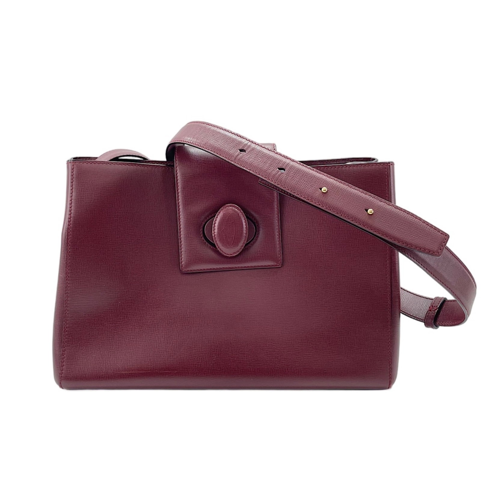 Shoulder Bag by Cartier: Shoulder Bag by Cartier Wine red Cartier shoulder bag with a sleek design, measuring 21.5cm x 33cm x 13cm. The bag features a strap length of 108cm - 115cm, making it a versatile accessory for