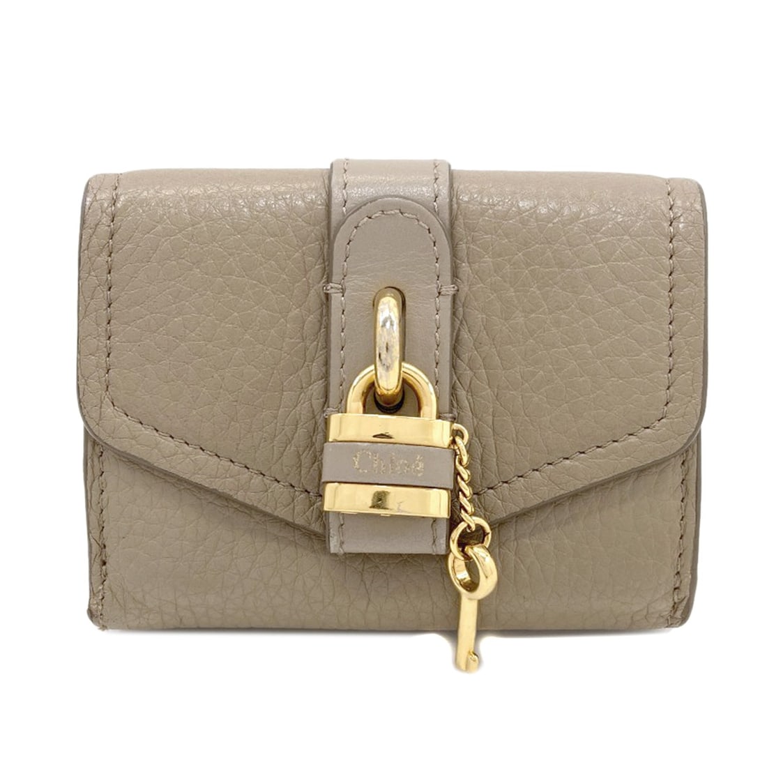 Chloe Abbey Bifold Wallet With Coin Pocket Leather: Chloe Abbey Bifold Wallet With Coin Pocket Leather Brown leather bifold wallet with a coin pocket, designed for everyday carry. The classic style features a simple and functional design, perfect for