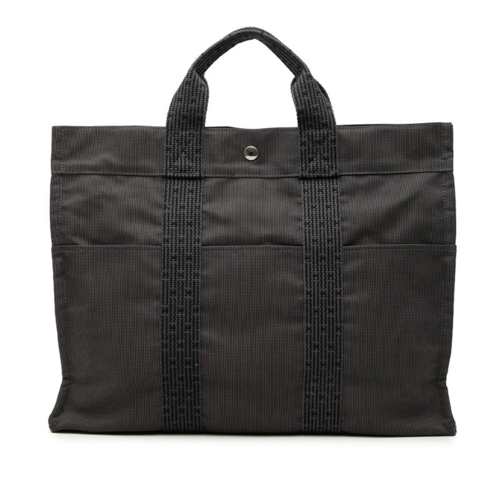 Handbag Tote Bag Canvas Hermes: Handbag Tote Bag Canvas Hermes Gray canvas tote bag from Hermes, measuring 31cm x 43cm x 10.5cm, featuring a classic design. The bag's canvas material provides a sturdy and durable structure, while