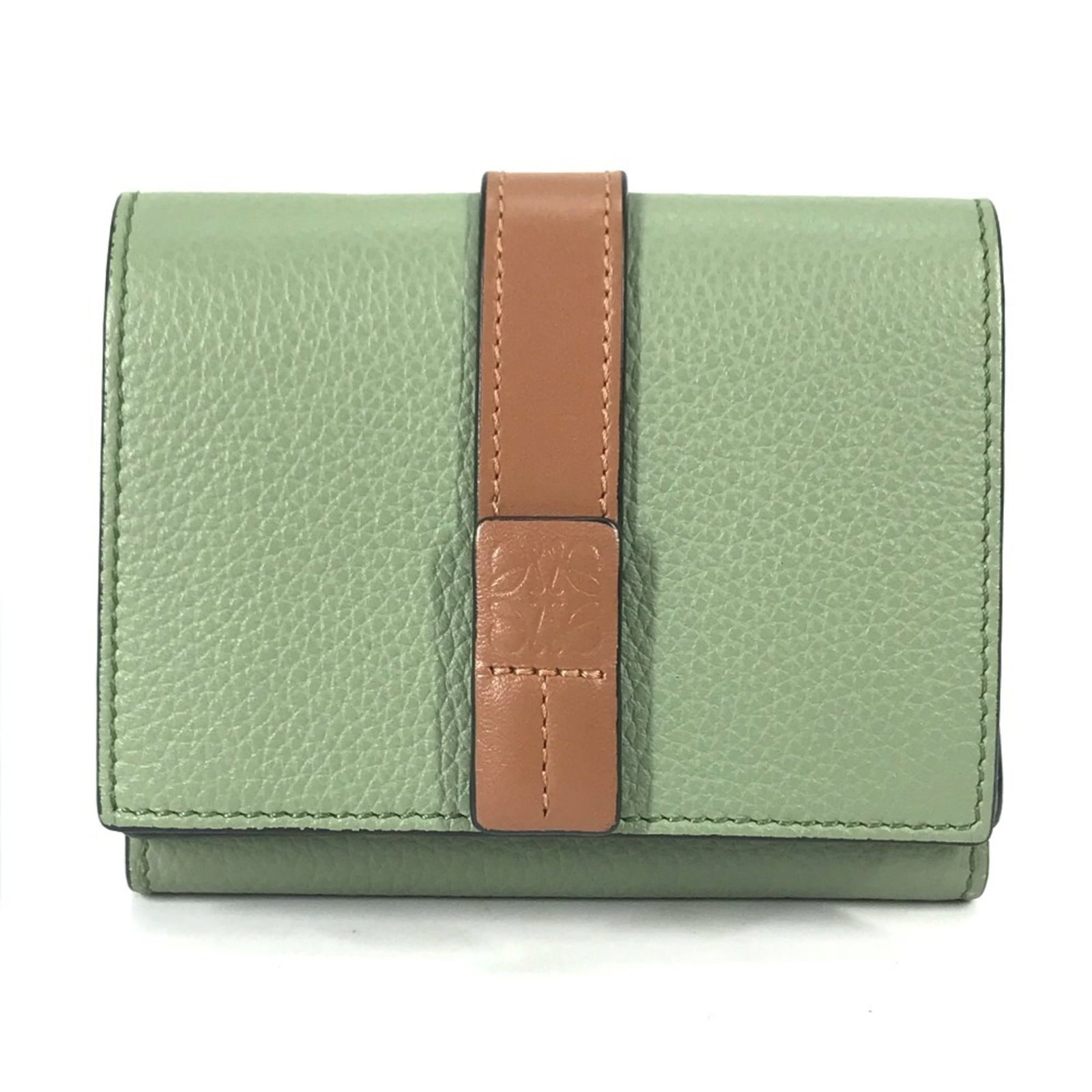 Loewe Wallet (Tri-Fold) Leather: Loewe Wallet (Tri-Fold) Leather Tri-fold leather wallet from Loewe, featuring a classic design with clean lines and a timeless brown or green color. Made from high-quality leather, this wallet