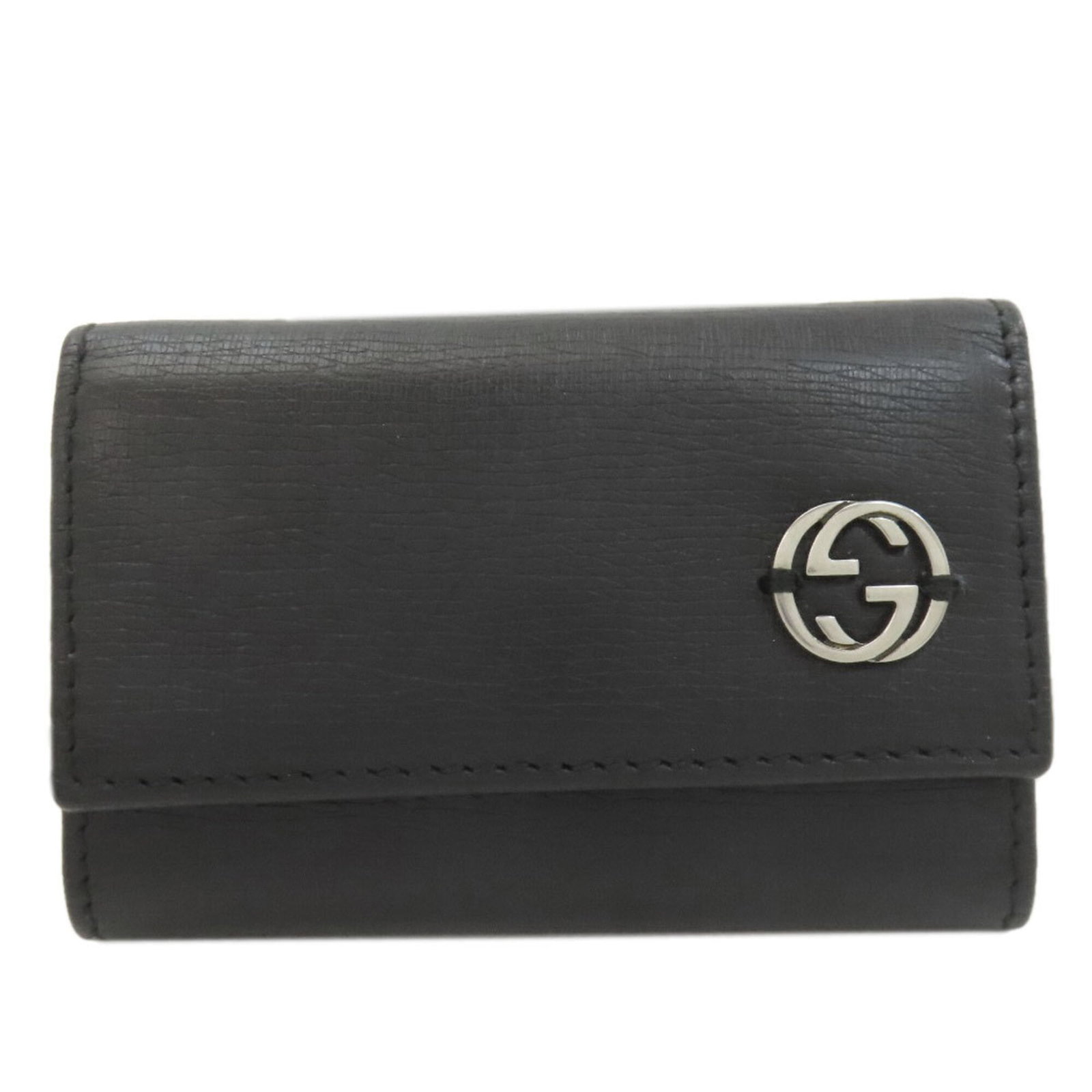 Key Leather Case Interlocking Women'S Gucci: Key Leather Case Interlocking Women'S Gucci The Gucci leather case is a sleek and sophisticated accessory, featuring a classic interlocking design in black leather. Measuring 9.5cm x 6.5cm x 1.5cm,