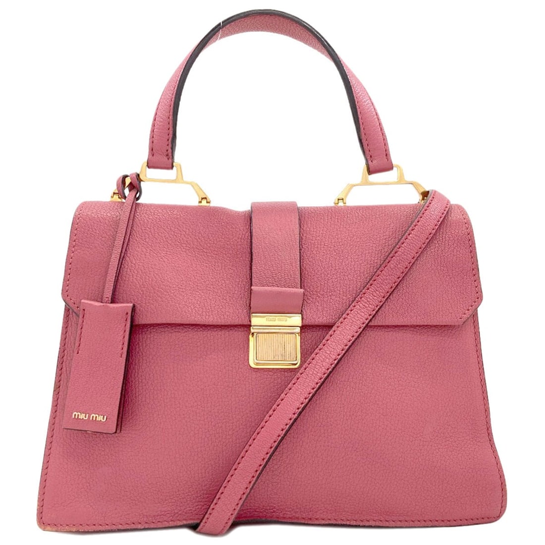 Handbag Leather 2Way Miumiu: Handbag Leather 2Way Miumiu Pink leather handbag from MIUMIU, featuring a 2-way design. Made from high-quality leather, this stylish bag is a great addition to any wardrobe. Item Specifics: Brand: