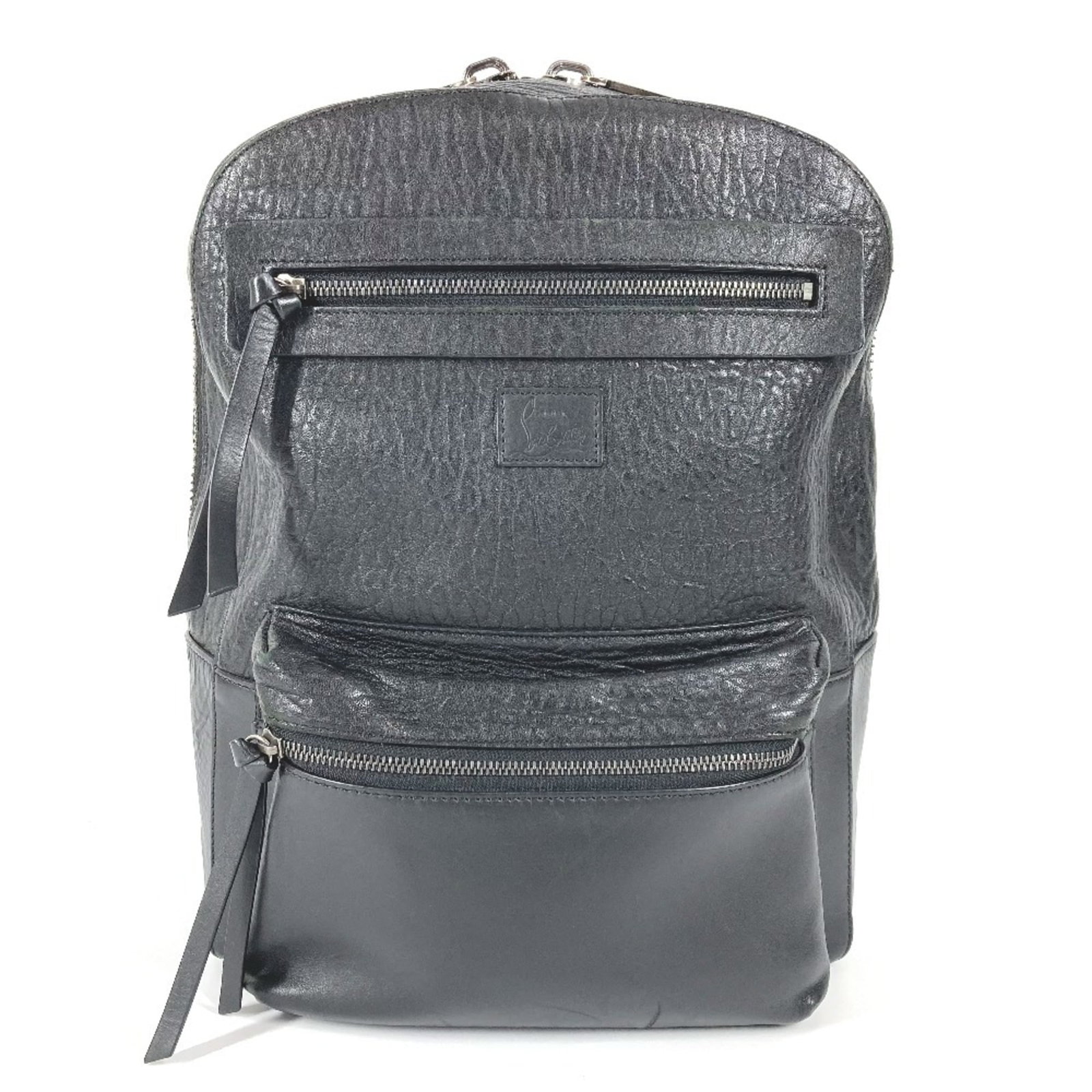 Christian Louboutin Backpack Leather: Christian Louboutin Backpack Leather Black and red leather backpack with zipper closure, measuring 37cm x 29cm x 13.5cm. This Christian Louboutin design combines sleek style with functional design,
