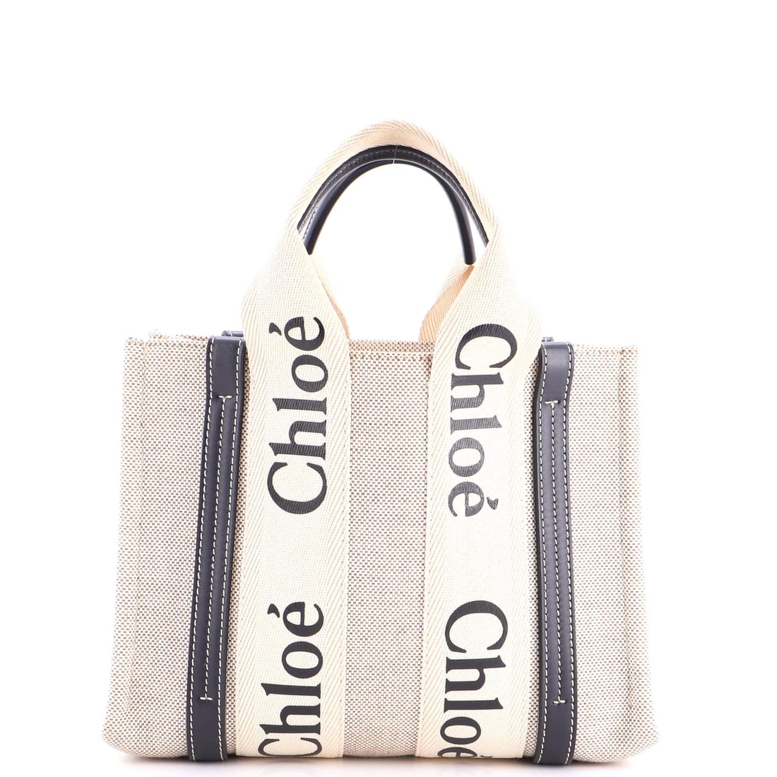 Woody Canvas Tote Small Leather Chloe: Woody Canvas Tote Small Leather Chloe Small leather Chloe tote with canvas exterior in neutral color, featuring a blue tone. The tote boasts a classic design with a small size, perfect for everyday
