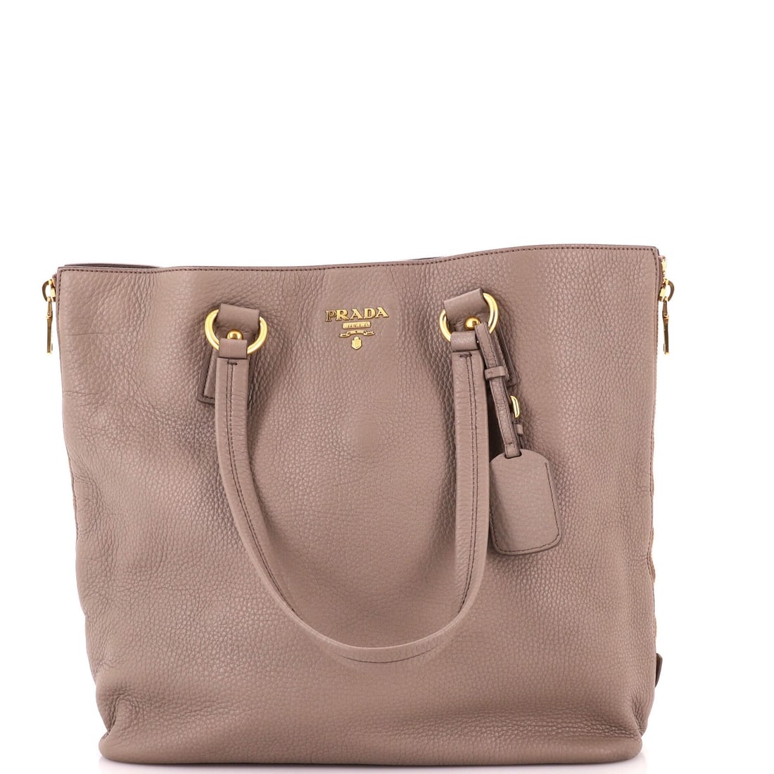 Vitello Daino Large Prada Tote Shopper Side: Vitello Daino Large Prada Tote Shopper Side Vitello Daino Large Prada Tote Shopper Side is a neutral-colored, large tote bag with a gold hardware and a side zip closure. Made from high-quality leather
