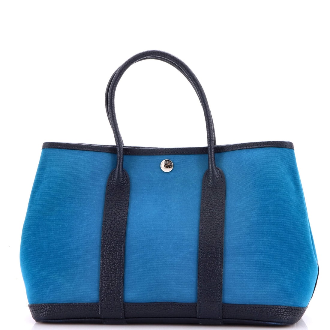 Toile Leather Hermes Garden Party Tote 30: Toile Leather Hermes Garden Party Tote 30 Toile Leather Hermes Garden Party Tote 30 in Blue features a classic design with a timeless blue canvas exterior and interior, complemented by the iconic