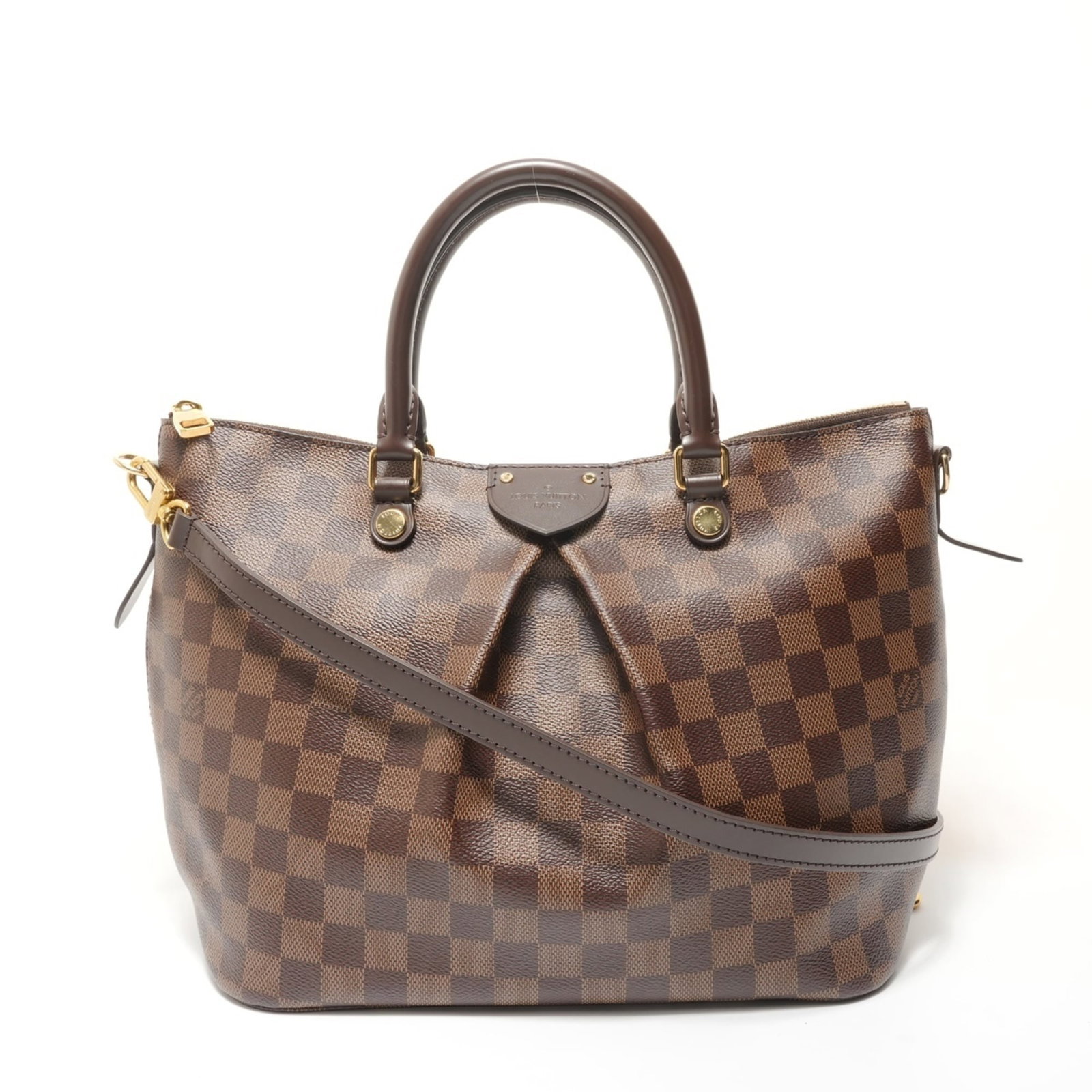 Handbag Louis Vuitton: Handbag Louis Vuitton This Louis Vuitton handbag is a classic example of the iconic Damier Canvas design, featuring a rich brown Ebene leather exterior. Measuring 23cm x 39cm x 14.5cm, it boasts a tim