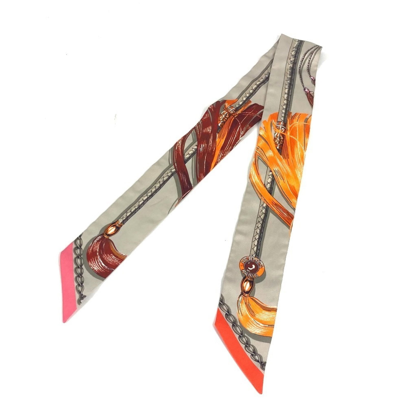 Silk Hermes Scarf: Silk Hermes Scarf Silk from renowned French fashion house Hermes, this gray scarf boasts a sleek 5cm width, perfectly complementing its 86.5cm length. Made from luxurious silk, its compact size makes 