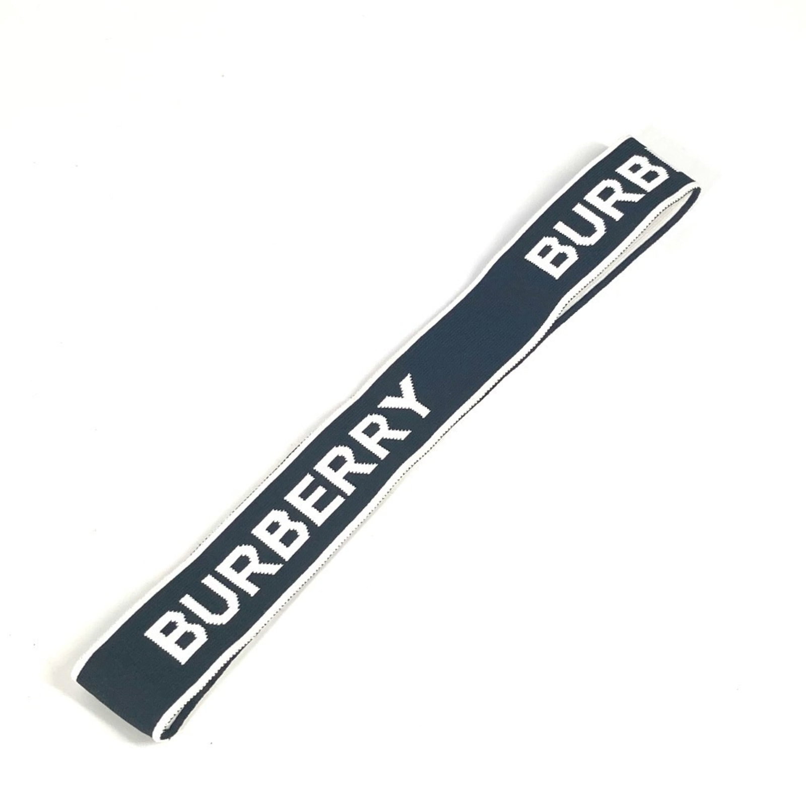 Burberry Nylon Headband: Burberry Nylon Headband Burberry Nylon Headband is made from durable nylon material and features a sleek black and white color combination. The headband measures 3cm x 25cm and is designed to be a fun