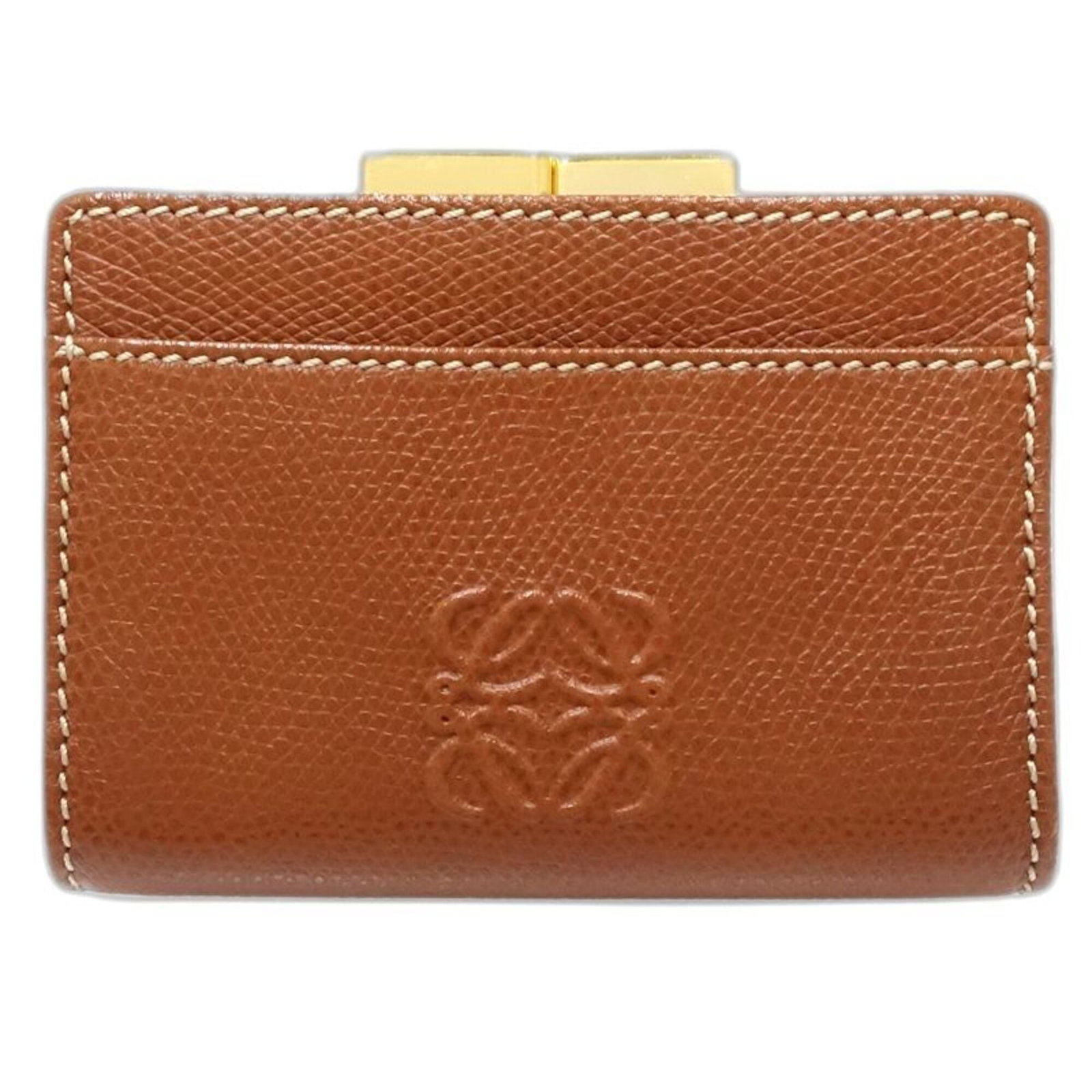 Loewe Coin Purse/ Coin Case Leather: Loewe Coin Purse/ Coin Case Leather This exquisite Loewe coin purse is crafted from rich, high-quality leather, showcasing a timeless brown color. Measuring 7cm x 10cm x 2cm, it offers a compact and e